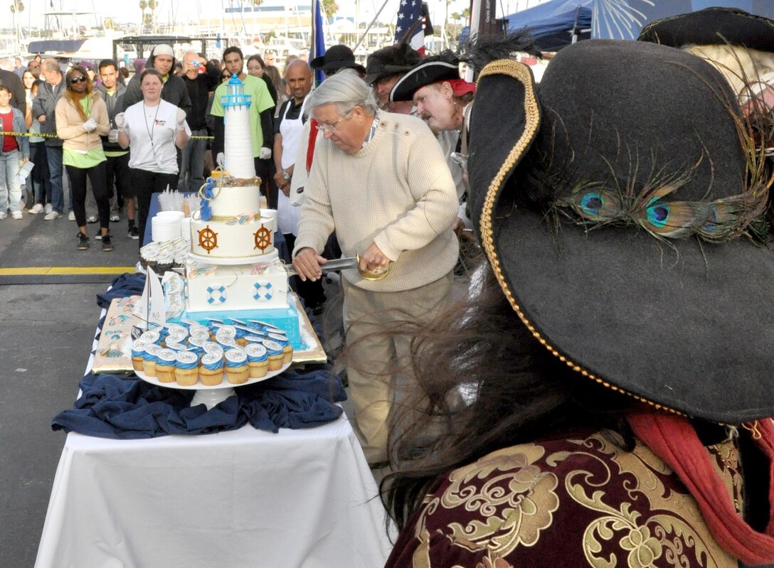 Los Angeles County Supervisor Don Knabe, with help from local pirates, cuts the birthday cake  during the 50th Birthday Bash April 10.