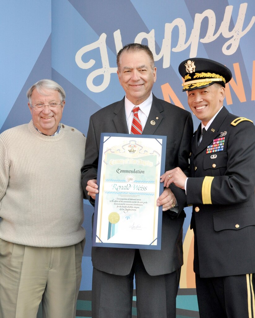 Brig. Gen. Mark Toy, commanding general of the USACE South Pacific Division and Don Knabe, Los Angeles County supervisor, presented a scroll to Ron Weiss, a former USACE employee who worked on the marina since its beginning in the 1950s at a ceremony April 10. USACE workers were recognized at Marina del Rey's 50th Birthday Bash for the design and work efforts in taking and keeping Marina del Rey from the duck hunting marsh it was into the marina it is today.