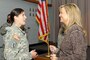 Army Sgt. Mercedes Millward, Sisters-In-Arms advisory board member, thanks Sharlene Wells Hawkes for setting an example for female leaders by sharing her personal stories and message. Hawkes was the keynote speaker during the Utah Sisters-In-Arms program kickoff event April 1, 2015. (Air National Guard photo by Capt. Jennifer Eaton/RELEASED)