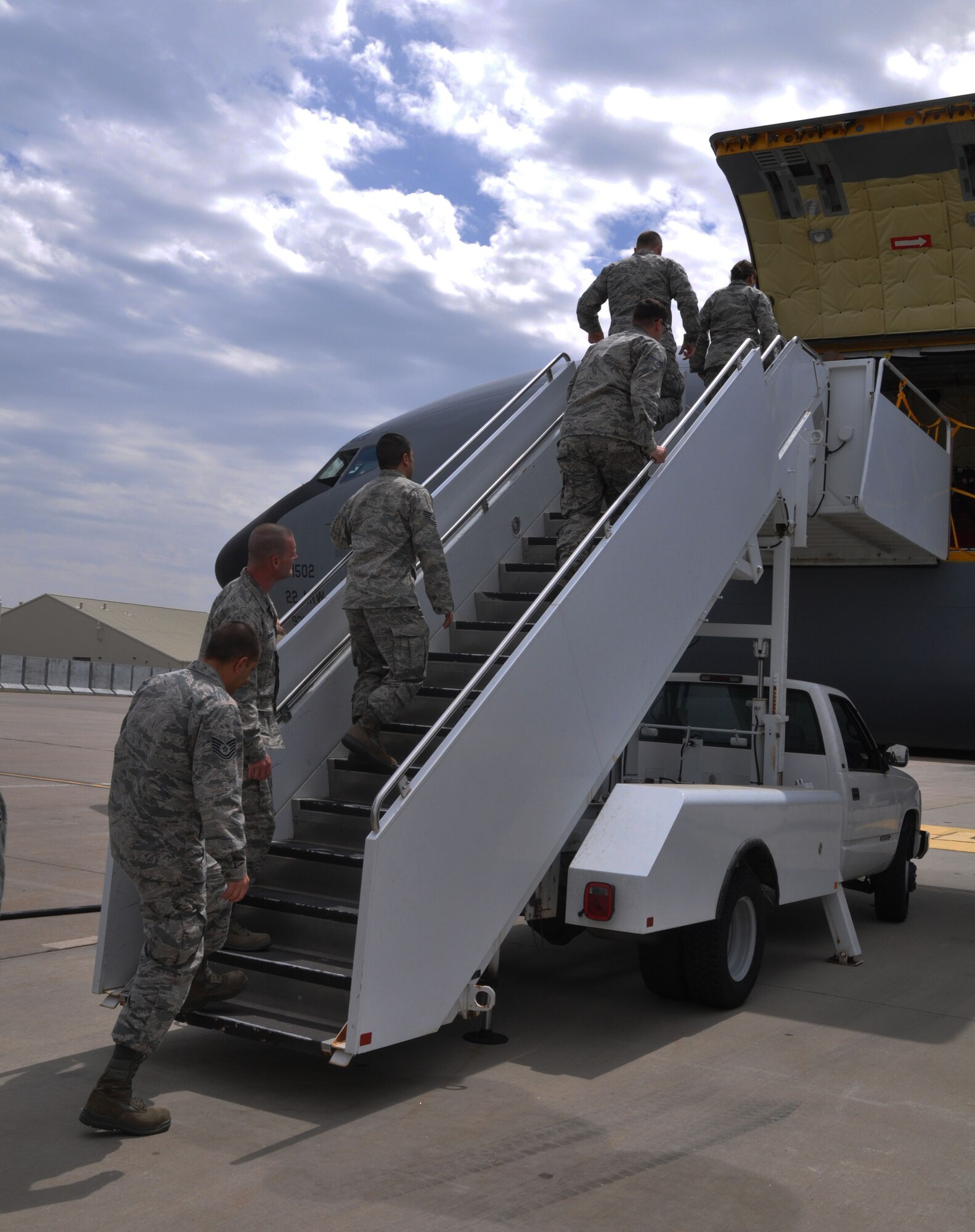 A group of more than 20 McConnell Reservists board a KC-135 Stratotanker at McConnell Air Force Base, Kan., Feb. 8, 2015. The aircraft was operated by an aircrew from the Air Force Reserve 931st Air Refueling Group and was transporting the reservists to a unit deployment to at the 379th Air Expeditionary Wing. While deployed, aircrew and support personnel from the 931 ARG will fly aerial refueling missions, perform aircraft maintenance and fill other support roles.