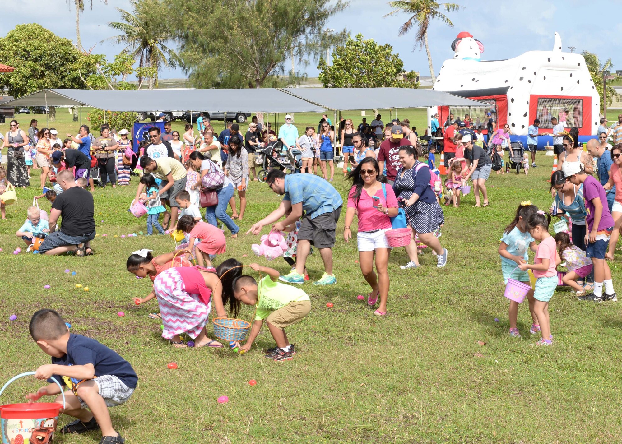 Andersen family members participate in an Easter egg hunt April 4, 2015, at Arc Light Memorial Park on Andersen Air Force Base, Guam. The annual event, which used approximately 7,000 eggs, was sponsored by a host of agencies across the base and drew more than 650 children. (U.S. Air Force photo by Senior Airman Cierra Presentado/Released)