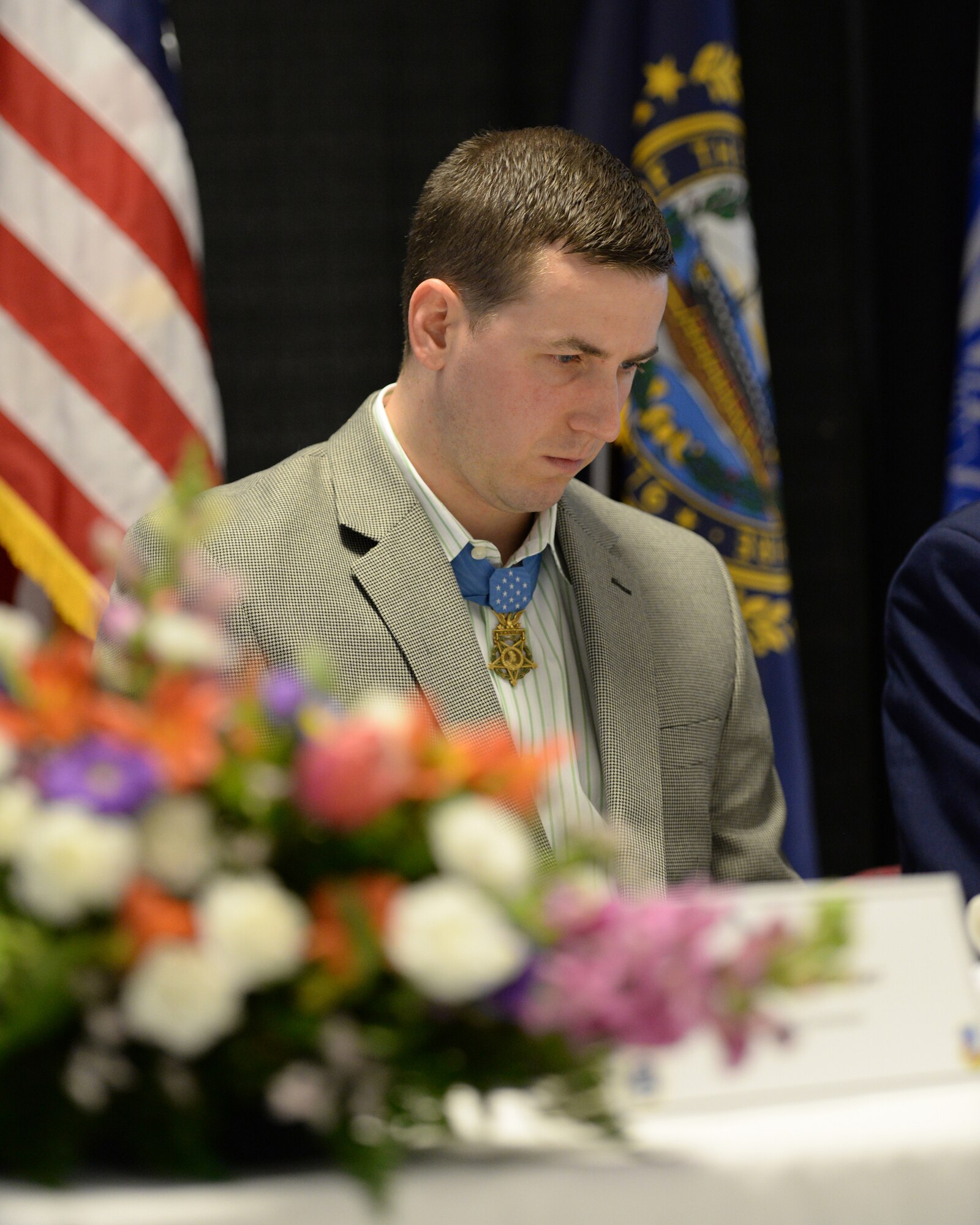 Former U.S. Army Staff Sgt. Ryan Pitts bows his head in prayer during the Commander’s Annual Prayer Breakfast, Pease Air National Guard Base, N.H. April 12, 2015.  Pitts, a 2014 Medal of Honor recipient was guest speaker at the event. (U.S. Air National Guard photo by Tech Sgt. Aaron P. Vezeau)