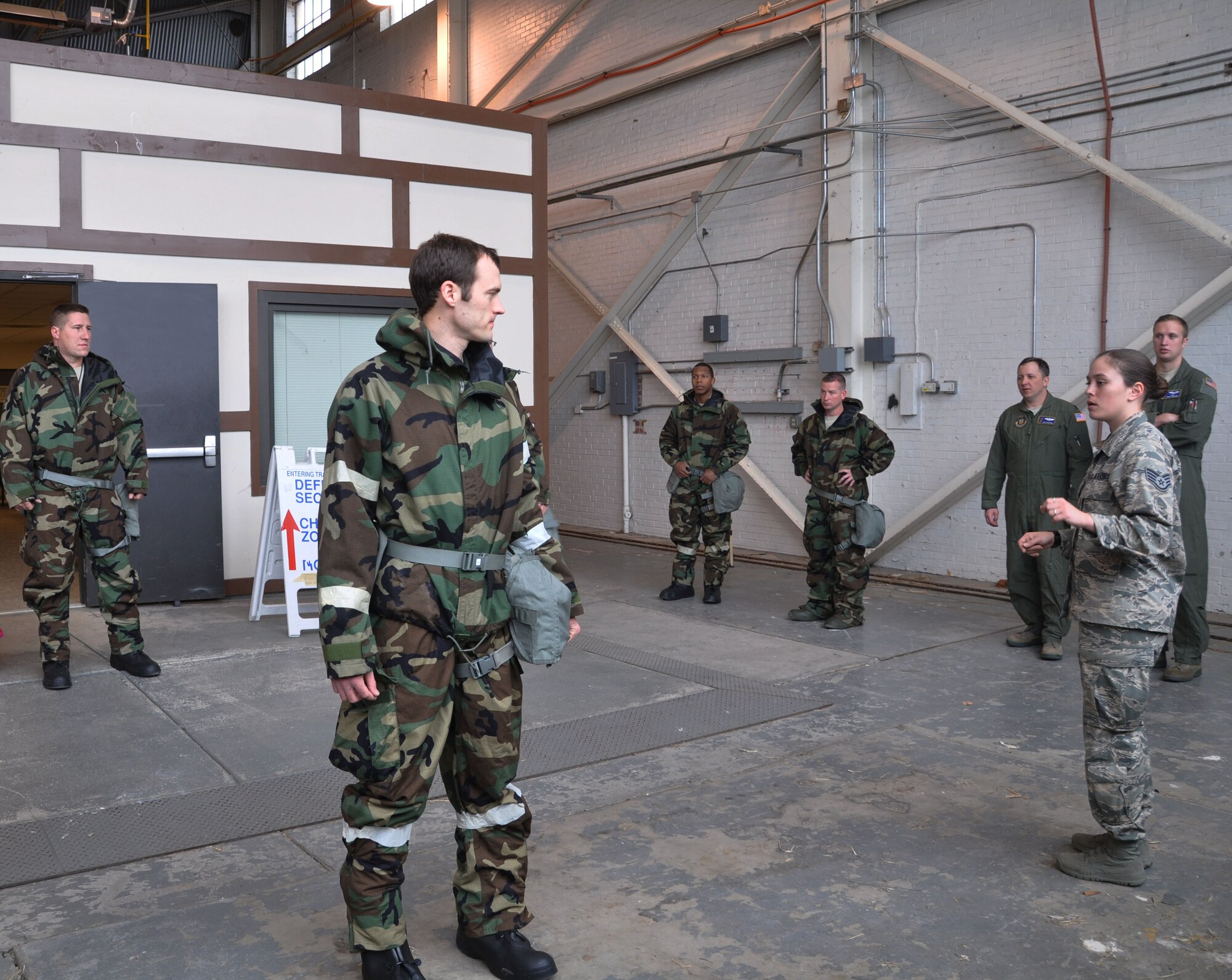 Members of the 931st Air Refueling Group participate in a hazardous material clearing scenario during a CBRNE training session April 12, 2015, McConnell Air Force Base, The training teaches the Airmen how to react should they encounter any chemical, biological, radiological/nuclear or explosive operations (U.S. Air Force photo by Tech. Sgt. Abigail Klein)