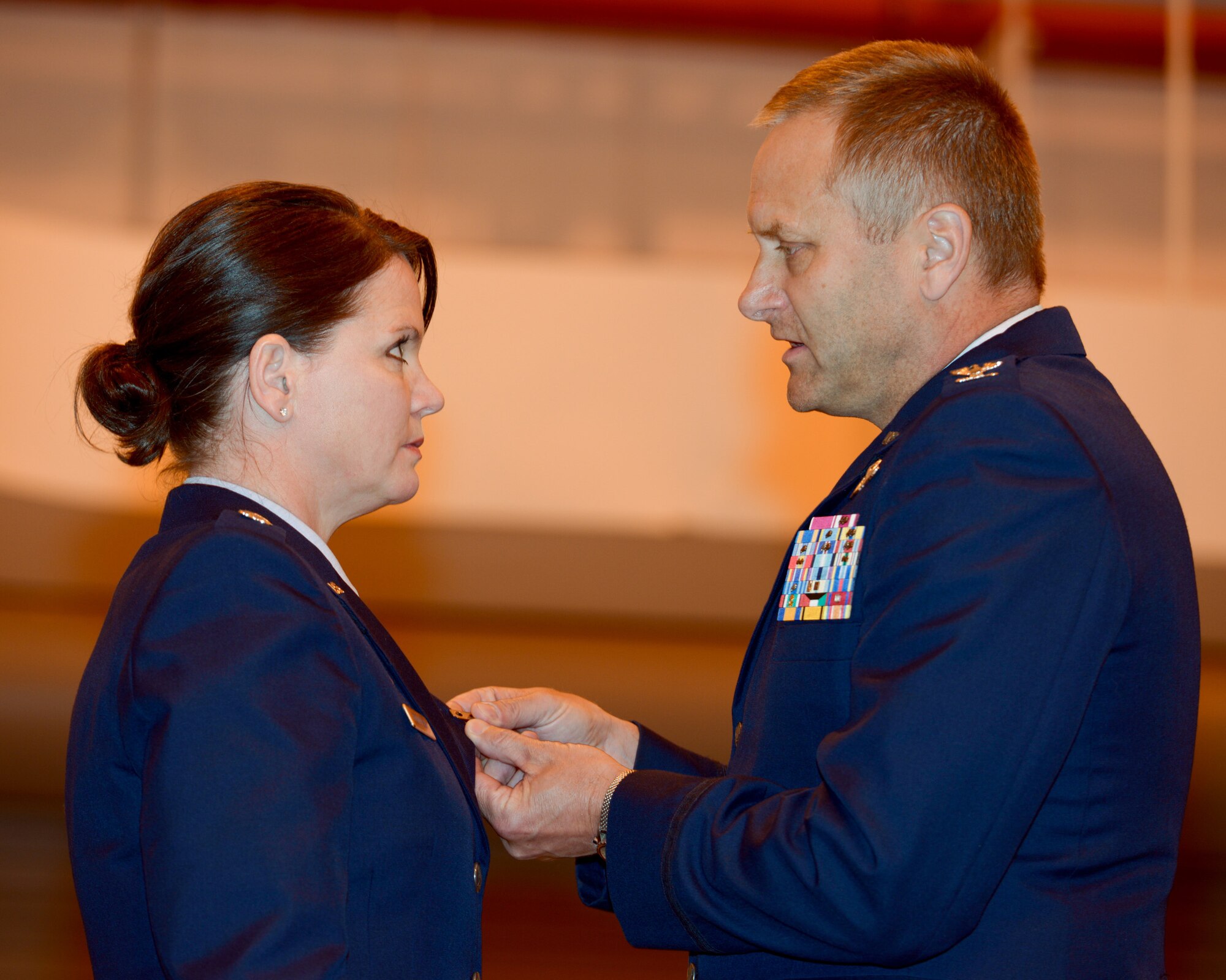 U.S. Air Force Col Timothy J. LaBarge, commander of the 105th Airlift Wing, New York Air National Guard, fastens the Bronze Star Medal with Valor onto Lt Col Linda Rohatsch's lapel during the posthumous award on behalf her son, Staff Sgt. Todd "T.J." Lobraico at a ceremony held in a hangar on Stewart Air National Guard Base April 11, 2015. Todd Lobraico Jr., a member of the 105th Airlift Wing, was killed in action in Afghanistan on Sept. 5, 2013, (U.S. Air National Guard photo by SSgt Michael OHalloran/Released) 