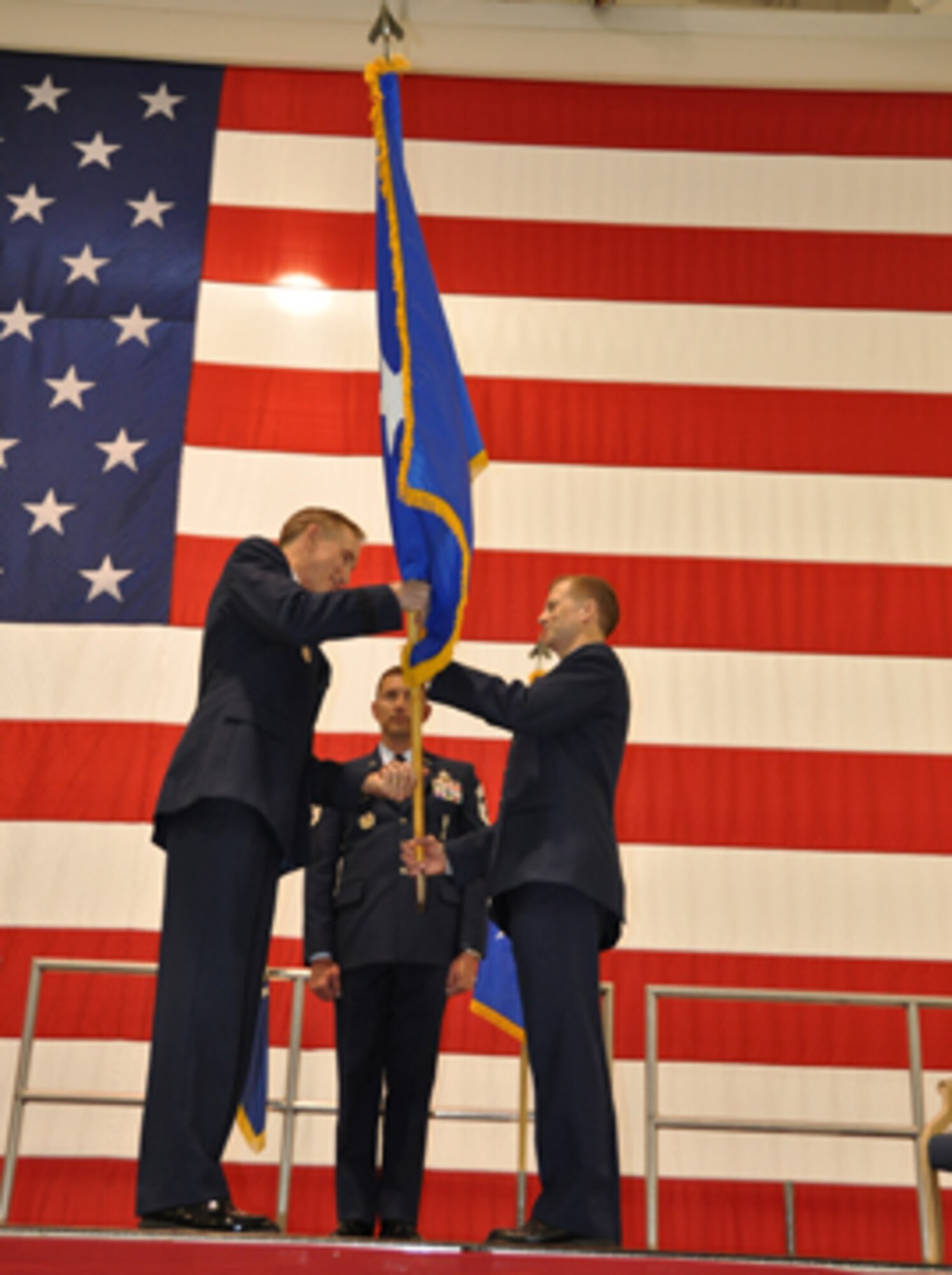Major General Craig Gourley, Deputy Inspector General of the Air
Force, hands the flag to Brig. Gen. Hubert "Hubie" Hegtvedt, 442d Fighter
Wing commander, during his promotion ceremony here April, 11. Passing of the
flag is a long time tradition in the military as one steps into a new rank
or position. (U.S. Air Force photo by Capt. Denise Haeussler)
