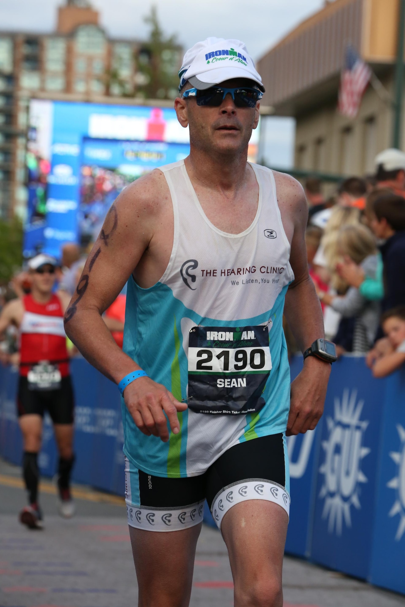 Chief Master Sgt. Sean Larson of the 132d Wing competes in the running portion of a triathlon  (U.S. Air National Guard photo by Senior Airman Matthew T. Doyle/Released)