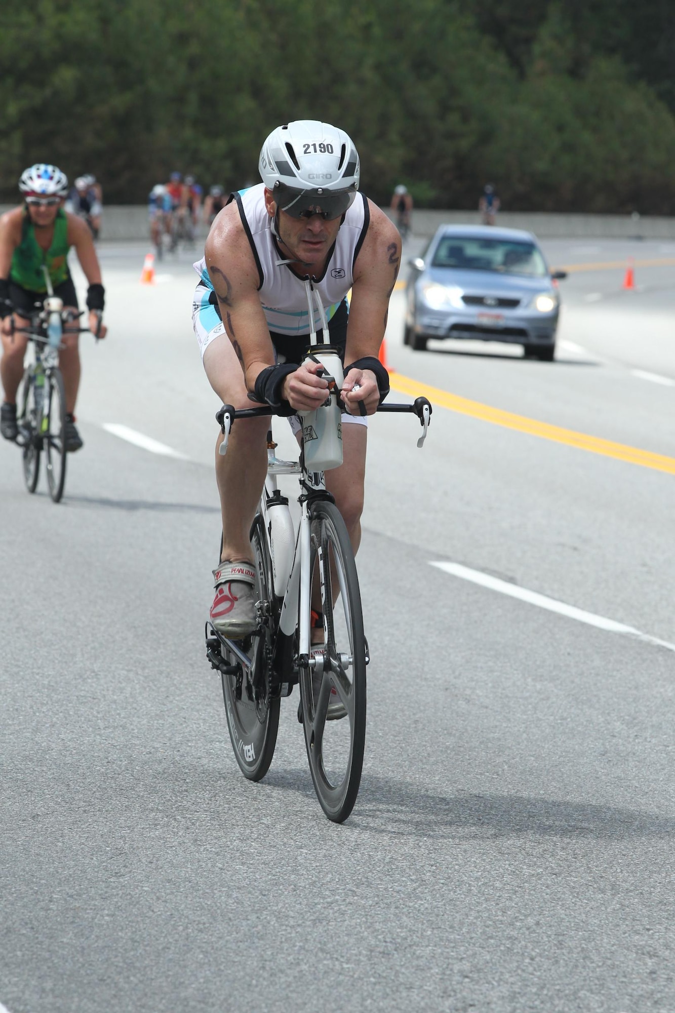 Chief Master Sgt. Sean Larson of the 132d Wing competes in the biking portion of a triathlon.  (U.S. Air National Guard photo by Senior Airman Matthew T. Doyle/Released)