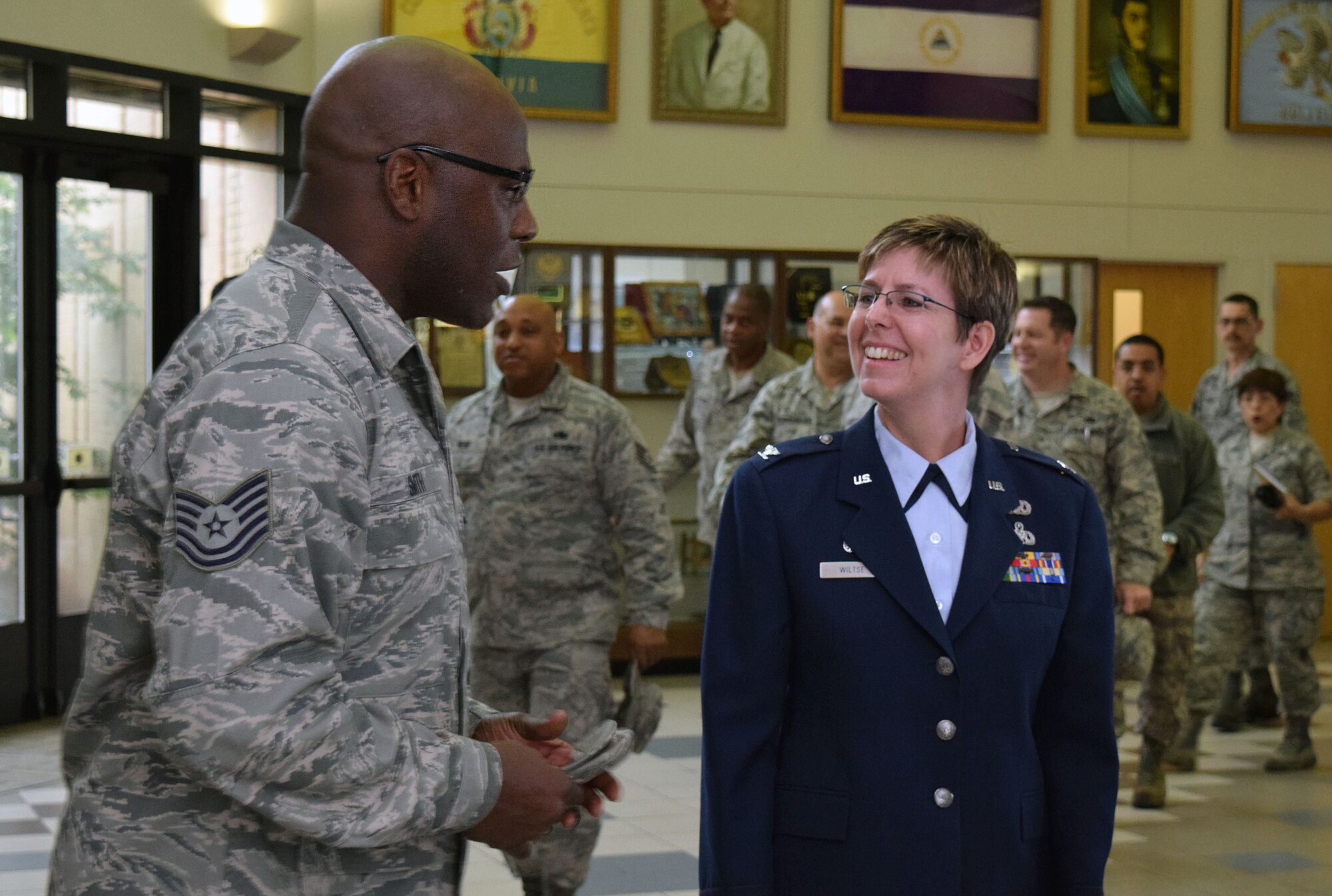 Tech. Sgt. Stewart Smith, 433rd Maintenance Squadron maintainer, congratulates Col. Gretchen M. Wiltse, 433rd Maintenance Group commander, after the 433rd MXG assumption of command ceremony April 12, 2015 at the Inter-American Forces Academy auditorium on Joint Base San Antonio-Lackland. (U.S. Air Force photo/Tech. Sgt. Lindsey Maurice)