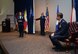 Col. Gretchen M. Wiltse, 433rd Maintenance Group commander, thanks Col. William W. Whittenberger Jr., 433rd Airlift Wing commander, during the 433rd MXG assumption of command ceremony April 12, 2015 at the Inter-American Forces Academy auditorium on Joint Base San Antonio-Lackland. (U.S. Air Force photo/Tech. Sgt. Lindsey Maurice)