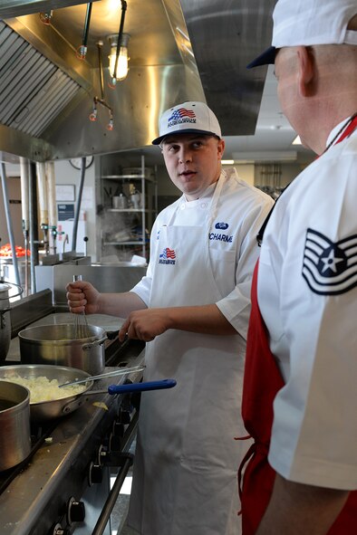 Airman 1st Class Ryan Ducharme, 157th Force Support Squadron Services Flight technician, prepares lunch for members of the N.H. Air National Guarrd during the April Unit Training Assembly in the kitchen of the Aerospace Dining Facility April 11. The 157 FSS team has been selected as one of the top three Air National Guard food services operations in the nation. Entering its 15th year, the Senior Master Sergeant Kenneth  Disney Award has been established to improve food service throughout the Air National Guard, increase morale, encourage competition, recognize excellence and honor the late Disney. Disney was the services superintendent at McGee Tyson Air Base, Tenn., for more than 20-years where he earned a reputation for commitment to providing outstanding food service. (N.H. Air National Guard photo by Senior Airman Kayla McWalter)