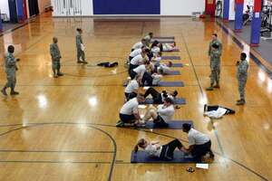 150412-Z-VA676-022 -- Airmen of the 127th Wing conduct sit-ups in a newly-refurbished gymnasium building at Selfridge Air National Guard Base, Mich., April 12, 2015. The gym building, constructed in the early 1930s, was recently refurbished for use as a fitness center after temporarily providing office space for one of the base’s flying squadrons. (U.S. Air National Guard photo by Tech. Sgt. Dan Heaton)