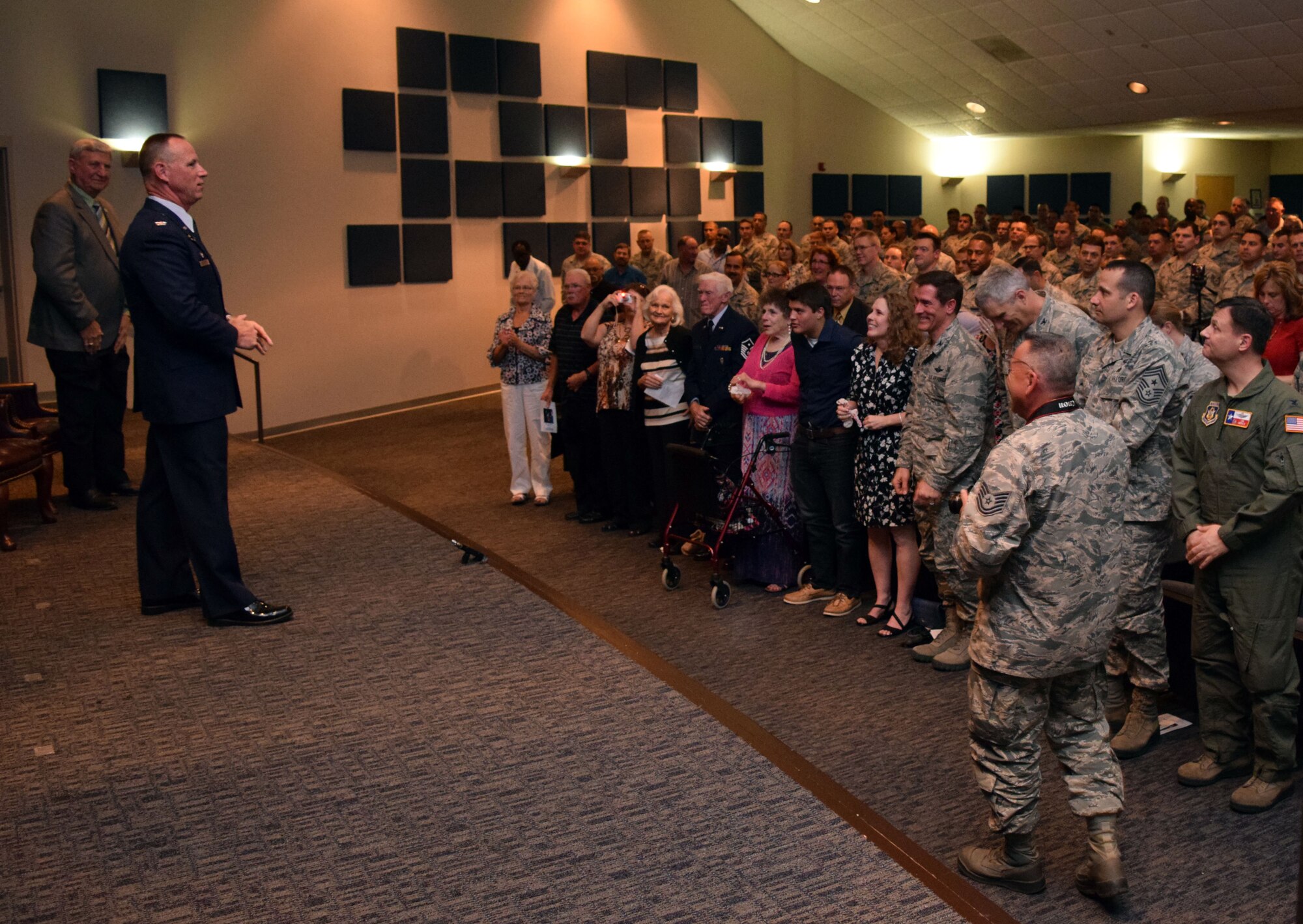 Col. Charles M. Combs, 433rd Maintenance Group commander, addresses the crowd at his retirement ceremony April 11, 2015 at the Inter-American Air Force Academy, Joint Base San Antonio-Lackland, Texas. Airmen and civilians from across the wing, as well as family and friends, filled the theater to thank the more than 30-year Air Force veteran for his service and to wish him well in retirement. (U.S. Air Force photo/Tech. Sgt. Lindsey)