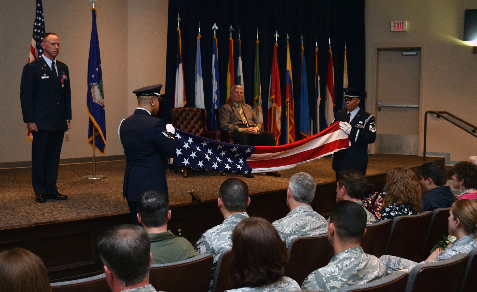 The 433rd Airlift Wing Honor Guard performs a flag-folding ceremony during Col. Charles M. Combs’ retirement ceremony April 11, 2015 at the Inter-American Air Force Academy, Joint Base San Antonio-Lackland, Texas. Col. Combs' Air Force career spanned more than 30 years and 11 assignments, with his last assignment as the 433rd Maintenance Group commander, here at Joint Base San Antonio-Lackland, Texas. (U.S. Air Force photo/Tech. Sgt. Lindsey)

