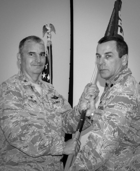 Lt. Col. Carl Spear Jr., accepts the guidon from Col. Jim Phillips, 919th Special Operations Wing commander, during the 919th Special Operations Medical Squadron change of command ceremony at Duke Field, Fla.  The SOMDS is provides medical support for the reservists of the 919th SOW.  (U.S. Air Force photo/Dan Neely)