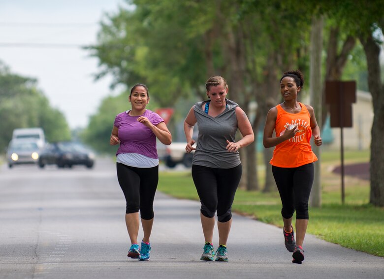 Reservists finish the race as a team during the spring 5k run and egg hunt April 11 at Duke Field, Fla. More than 50 people participated in the free event hosted by the Human Resource Development Council to boost base morale.  An Easter egg hunt followed the 5k at the playground with a bouncy house. (U.S. Air Force photo/Tech. Sgt. Jasmin Taylor)