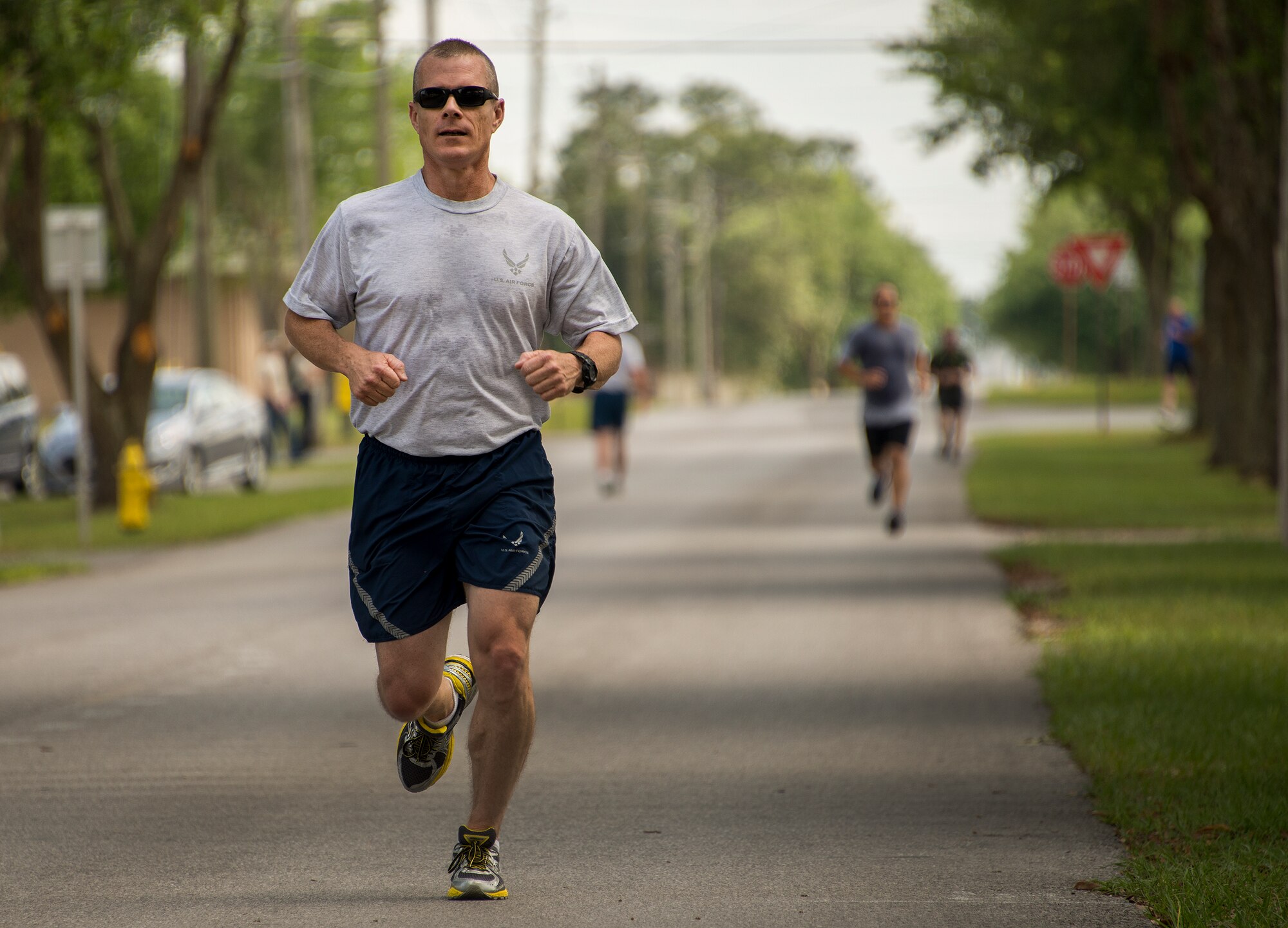A participant races to the finish line during the spring 5k run and egg hunt April 11 at Duke Field, Fla. More than 50 people participated in the free event hosted by the Human Resource Development Council to boost base morale.  An Easter egg hunt followed the 5k at the playground with a bouncy house. (U.S. Air Force photo/Tech. Sgt. Cheryl Foster)