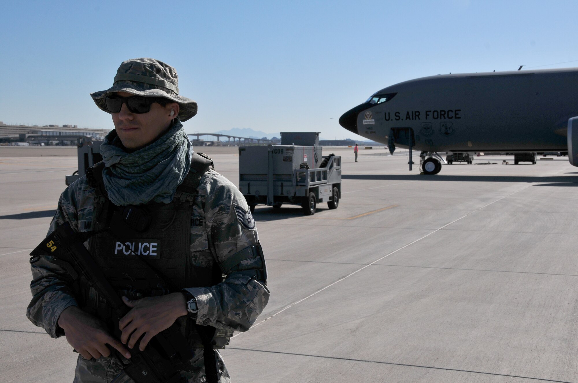 Staff Sgt. Eric Mirabal, 161st Security Forces Squadron member, secures the perimeter and stands guard over the KC-135r tanker during a generation exercise, Phoenix Sky Harbor Air National Guard Base, April 6, 2014. This mobility exercise involves “fast response” techniques in order to ensure the aircrew can react quickly and effectively when missions require a moment’s notice. (Air National Guard photo by Staff Sgt. Courtney Enos)