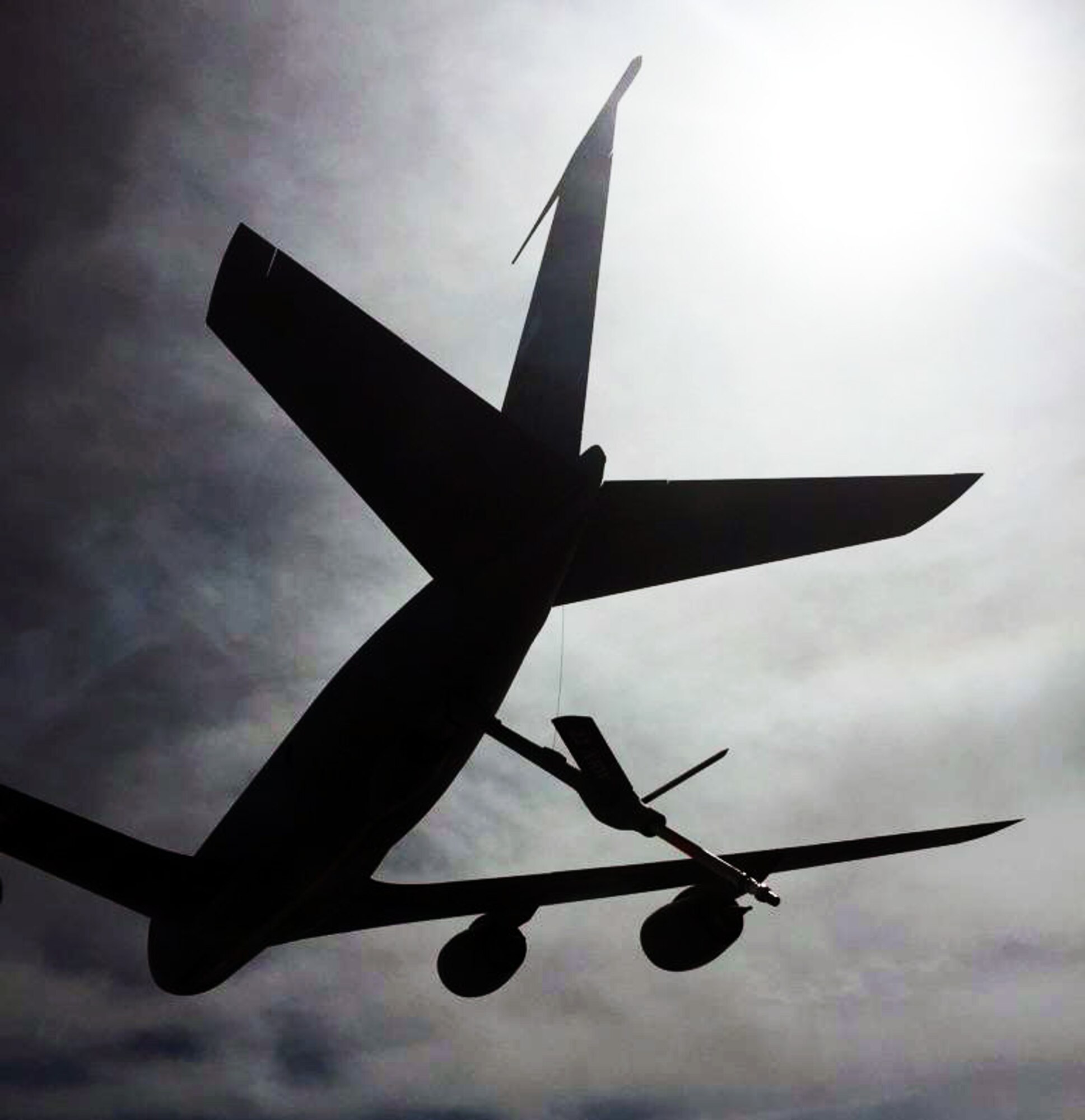 A K-135 Stratotanker assigned to McConnell Air Force Base, Kan., extends its refueling boom during receiver/tanker (R/T) training, April 11, 2015.  The KC-135 was operated by an aircrew made up of Air Force Reservists from the 18th Air Refueling Squadron, 931st Air Refueling Group, at McConnell.  The R/T training is a critical component to the eventual transition to the KC-46A Pegasus at McConnell. Unlike most KC-135 Stratotankers, the KC-46 has the ability to take on fuel while in flight. The first reserve pilots that will fly the KC-46 are required to be R/T qualified on specially-modified KC-135s before they can even begin the required training at the Boeing Flight Training Facility in Seattle, Wash. Fortunately, the 18th ARS has been actively working with members of the 22nd Air Refueling Wing to ensure that 18 ARS pilots are R/T certified before they attend KC-46 training in Washington next May. (U.S. Air Force photo by Senior Master Sgt. Ray Lewis)
