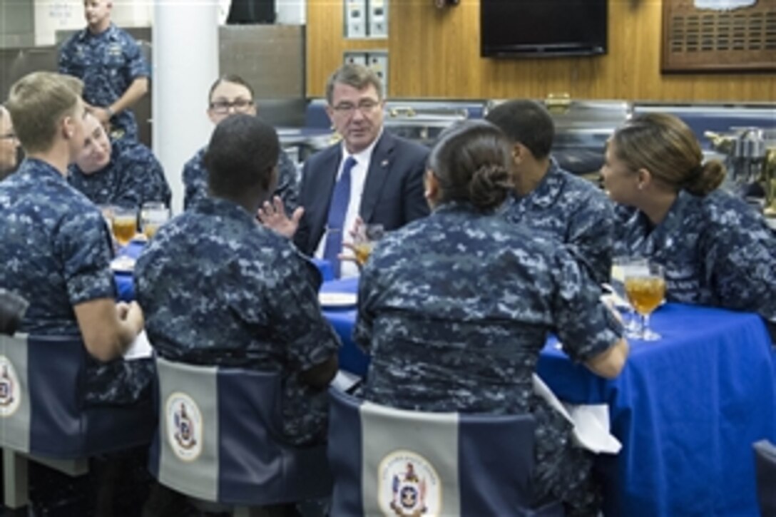 Defense Secretary Ash Carter eats lunch with junior sailors aboard the USS John Paul Jones in Pearl Harbor, Hawaii, April 11, 2015. Carter thanked the sailors for their efforts to help maintain peace and security in the region as he concluded his Asia-Pacific trip.