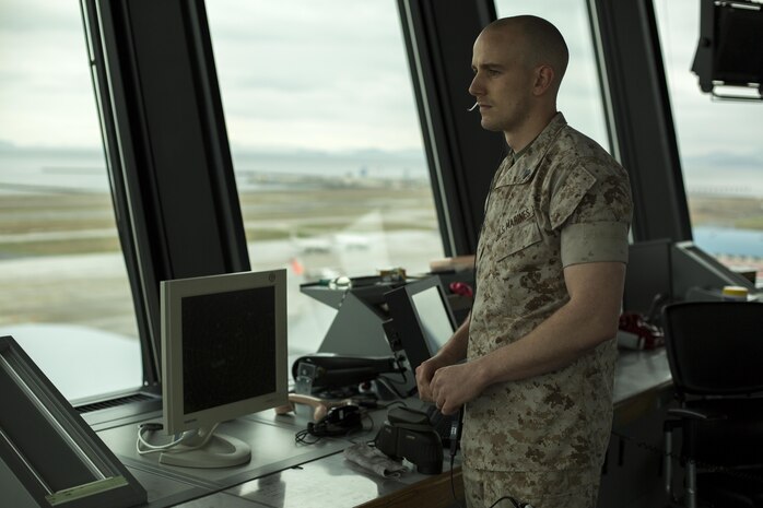 Sgt. Brandon Rockman, an air traffic control supervisor with Headquarters and Headquarters Squadron, communicates with oncoming aircraft inside the ATC Tower aboard Marine Corps Air Station Iwakuni, Japan, April 13, 2015. During Rockman’s time in MCAS Iwakuni he qualified in Tower Flight Data, Ground Control, Local Control and several others. He involved himself in more than 100,000 operations recording more than 16 hours of Tower Flight Data, 47 hours on Ground, 272 hours on Local and many more. He now has more hours recorded than any other noncommissioned officer in his crew.