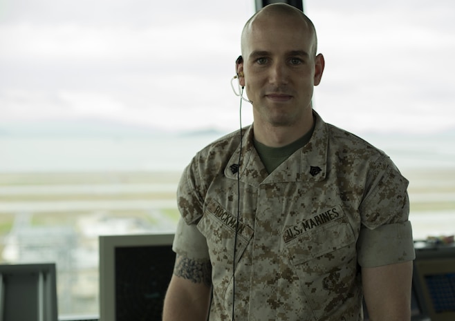 Sgt. Brandon Rockman, an air traffic control supervisor with Headquarters and Headquarters Squadron, poses for a picture inside the ATC Tower aboard Marine Corps Air Station Iwakuni, Japan, April 13, 2015. During Rockman’s time in MCAS Iwakuni he qualified in Tower Flight Data, Ground Control, Local Control and several others. He involved himself in more than 100,000 operations recording more than 16 hours of Tower Flight Data, 47 hours on Ground, 272 hours on Local and many more. He now has more hours recorded than any other noncommissioned officer in his crew.