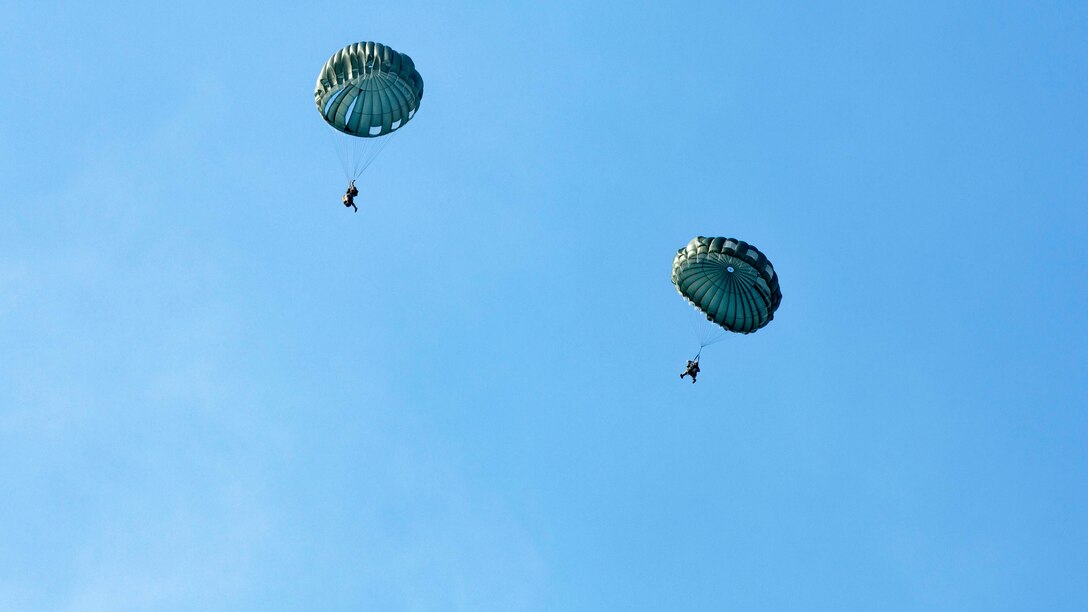 Marines participate in a jump drill from an MV-22 Osprey with Air Delivery Platoon, 2nd Transportation Support Battalion, aboard Marine Corps Base Camp Lejeune, N.C., April 9, 2015. Parachute Riggers, who must perform at least one jump per quarter, soared out of the Osprey to carry combat gear safely to the ground.