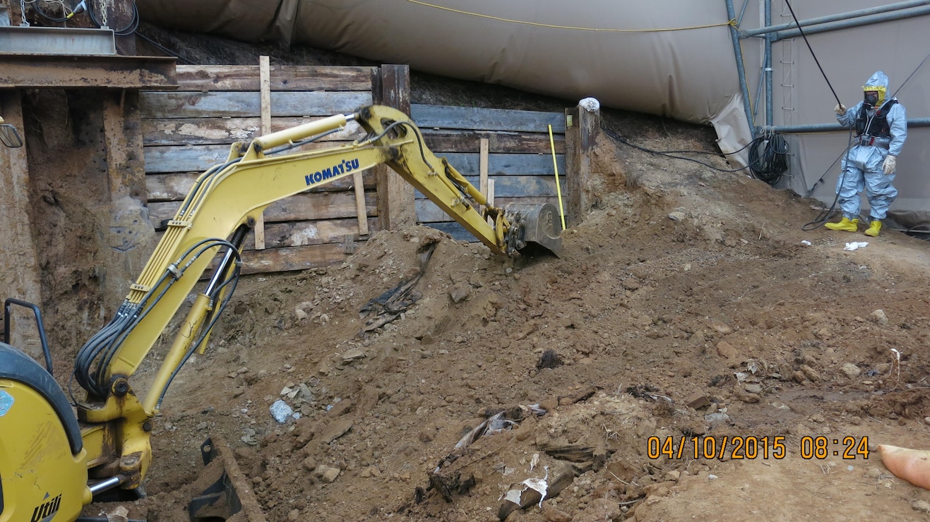 Crews work on lagging and excavation in the east corner of the backyard at 4825 Glenbrook Road. 