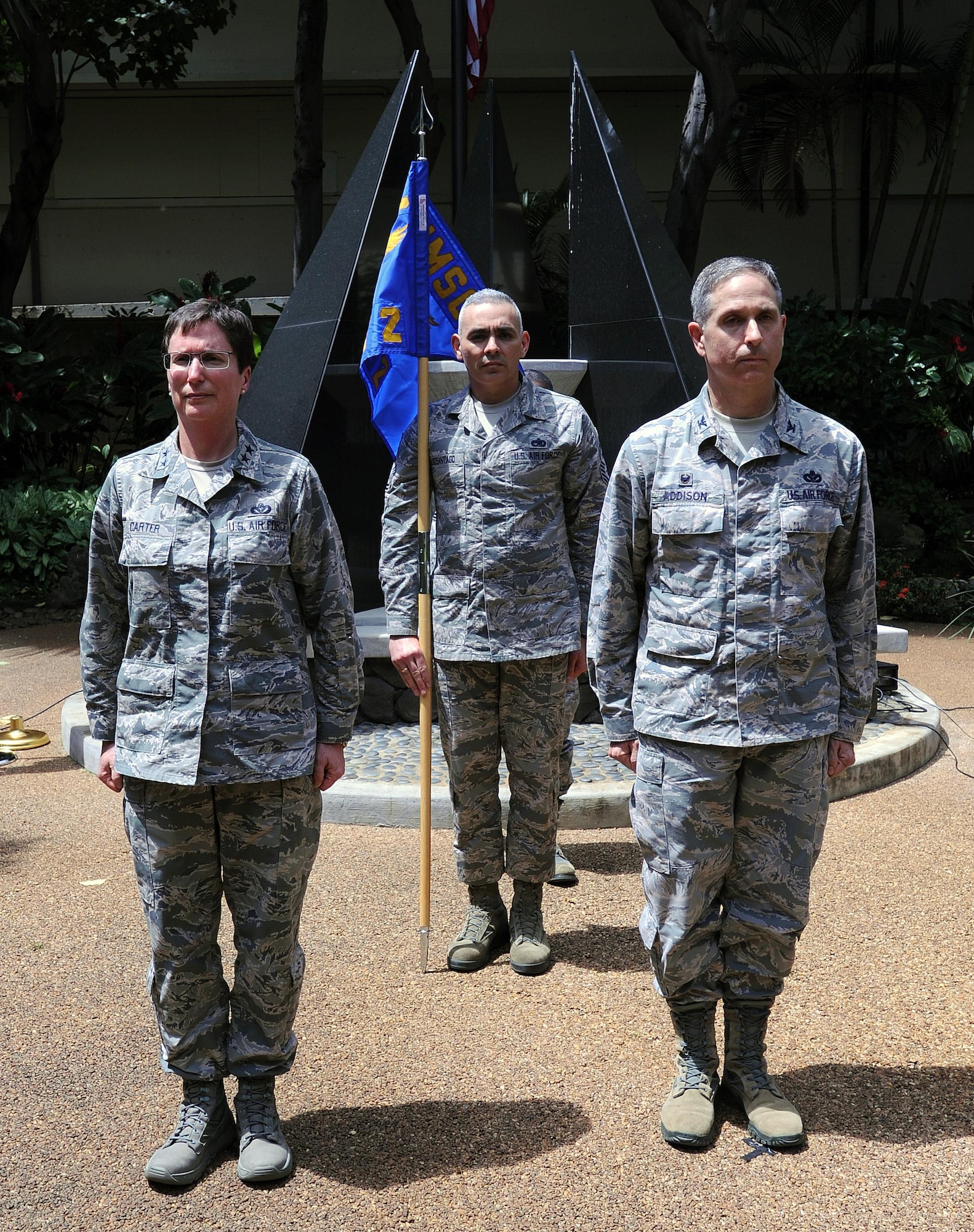 From left, Maj. Gen. Theresa Carter, Air Force Installation and Mission Support Center commander; Chief Master Sgt. Jose LugoSantiago, AFIMSC command chief; and Col. Mickey Addison, AFIMSC Det. 2 commander; await the official activation of the detachment, April 9, 2015, at Joint Base Pearl Harbor-Hickam, Hawaii. Detachment 2 is the first of 10 detachments of AFIMSC to be activated in the Air Force. (U.S. Air Force photo/Staff Sgt. Amanda Dick/Released)