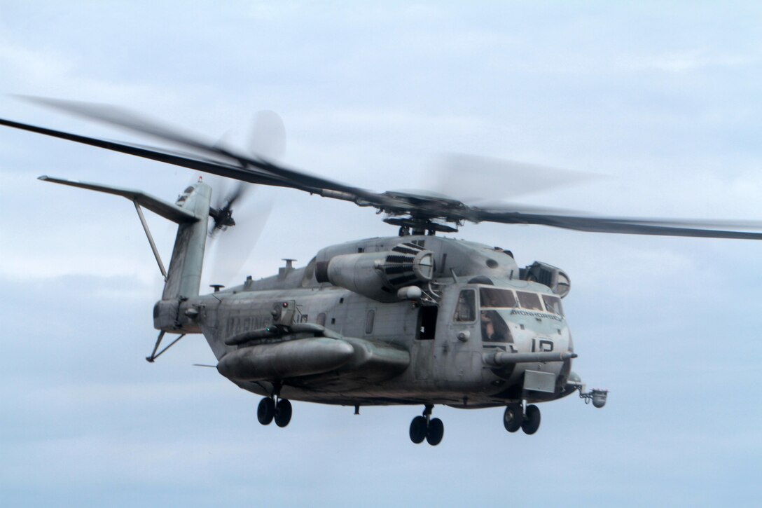 A CH-53E Super Stallion belonging to Marine Heavy Helicopter Squadron 461 flies above Bombing Target 11 on Piney Island, N.C., April 8, 2015.
The aircraft was part of an aerial tour of Marine Corps Air Station Cherry Point's outlying training facilities for members of the Civilian Military Community Council and Joint Land Use Study hosted by the air station. Air station leaders meet periodically with members of the CMCC and JLUS to strengthen ties between Cherry Point and surrounding communities. 
Pilots from Cherry Point and across 2nd Marine Aircraft Wing frequently train at BT-11 to prepare for expeditionary operations, sea-based force projection and aviation support of the Marine Air-Ground Task Force.