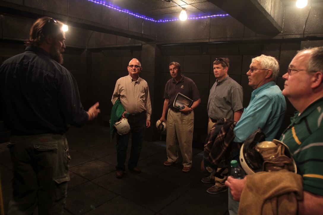 Range development support officer Chris Thompson speaks to members of the Civilian Military Community Council and Joint Land Use Study at Outlying Field Atlantic, April 8, 2015.
The CMCC and JLUS members visited OLF Atlantic as part of an aerial tour hosted by the air station of Cherry Point's outlying training facilities.
Air station leaders meet periodically with members of the CMCC and JLUS to strengthen ties between Cherry Point and surrounding communities. 
Pilots from Cherry Point and across 2nd Marine Aircraft Wing frequently train at OLF Atlantic to prepare for expeditionary operations, sea-based force projection and aviation support of the Marine Air-Ground Task Force.
