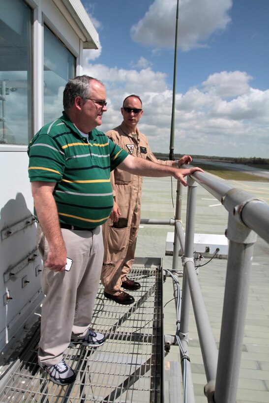 Pamlico County Manager Tim Buck and Col. Chris Pappas III take-in the view atop the landing signal officer's tower at Auxiliary Landing Field Bogue, N.C., during an aerial tour of Marine Corps Air Station Cherry Point's outlying training facilities, April 8, 2015.
Air station leaders meet periodically with members of the Civilian Military Community Council and Joint Land Use Study to strengthen ties between Cherry Point and surrounding communities. 
Pilots from Cherry Point and across 2nd Marine Aircraft Wing frequently train at ALF Bogue to prepare for expeditionary operations, sea-based force projection and aviation support of the Marine Air-Ground Task Force.