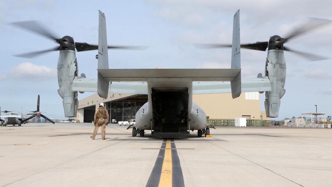Marines with Marine Medium Tiltrotor Squadron 163 perform pre-flight checks on MV-22B Ospreys prior to a large-scale training flight aboard Marine Corps Air Station Miramar, California, April 10. This training operation marks the last time the commanding officer of VMM-163 will participate in a squadron-sized event before relinquishing command. 