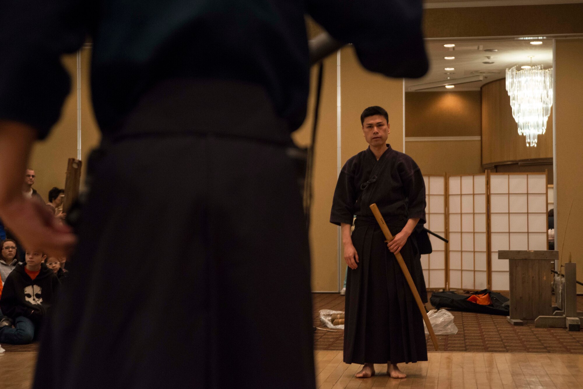 Japanese sword fighters square off before performing a demonstration during Japan Day at Misawa Air Base, Japan, April 11, 2015. Before and after each match, fighters take time to pay respects to one another. Hundreds of base residents attended Japan Day 2015 to absorb various forms of Japanese culture. (U.S. Air Force photo by Staff Sgt. Derek VanHorn/Released)