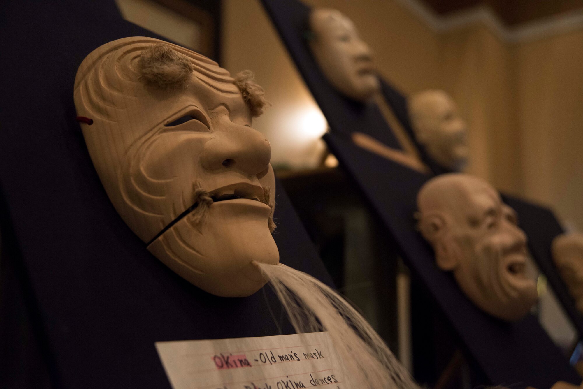 Japanese hand-carved wooden Hannya masks rest on display at the Misawa Club at Misawa Air Base, Japan, April 11, 2015. The Hannya mask is used during Japanese theatre productions called Noh, and is used to represent the souls of jealous women. Along with traditional Japanese performances, multiple booths were on display highlighting Japanese culture for Misawa’s service members and families. (U.S. Air Force photo by Staff Sgt. Derek VanHorn/Released)