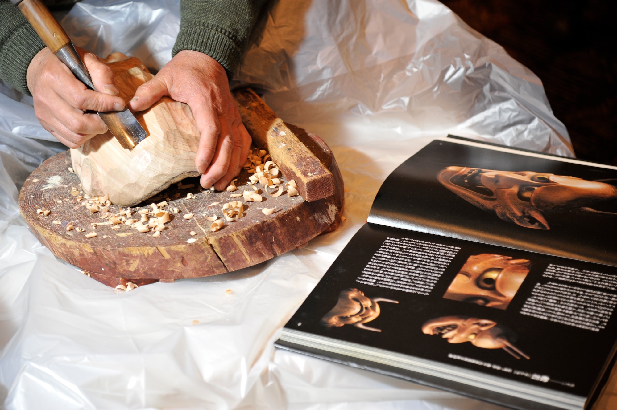 A Japanese volunteer begins the process for carving a Hannya mask during Japan Day at Misawa Air Base, Japan, April 11, 2015. The Hannya mask is used during Japanese theatre productions called Noh, and is used to represent the souls of jealous women. (U.S. Air Force photo by Senior Airman Patrick S. Ciccarone/Released)
