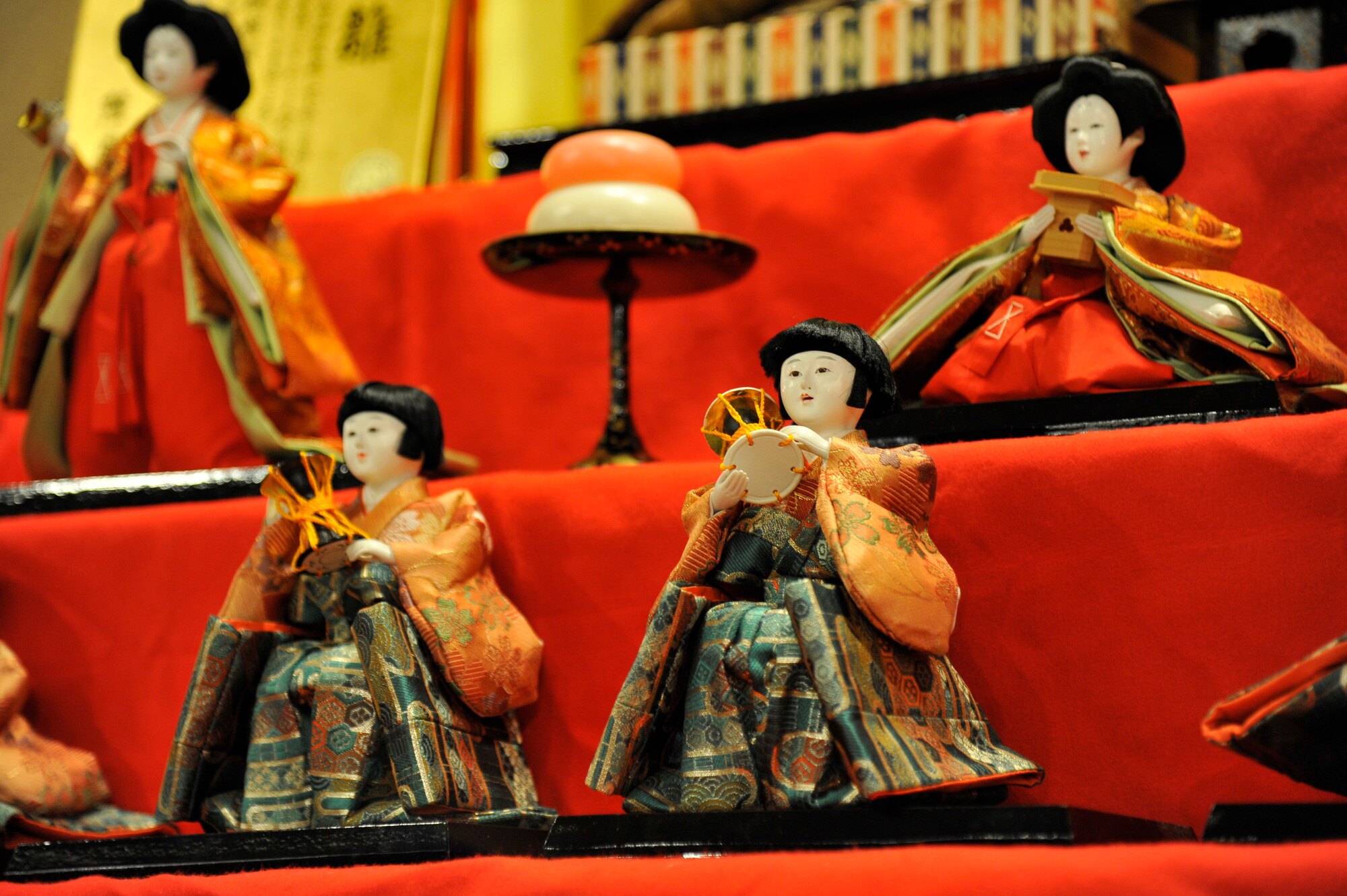 Japanese Hina dolls sit atop a display during Japan Day at Misawa Air Base, Japan, April 11, 2015. This display of Hina dolls, often a decorative piece for celebrations, was showcased in the main lobby of the enlisted club along with other exhibits like Bonsai trees and various paintings. (U.S. Air Force photo by Senior Airman Patrick S. Ciccarone/Released)