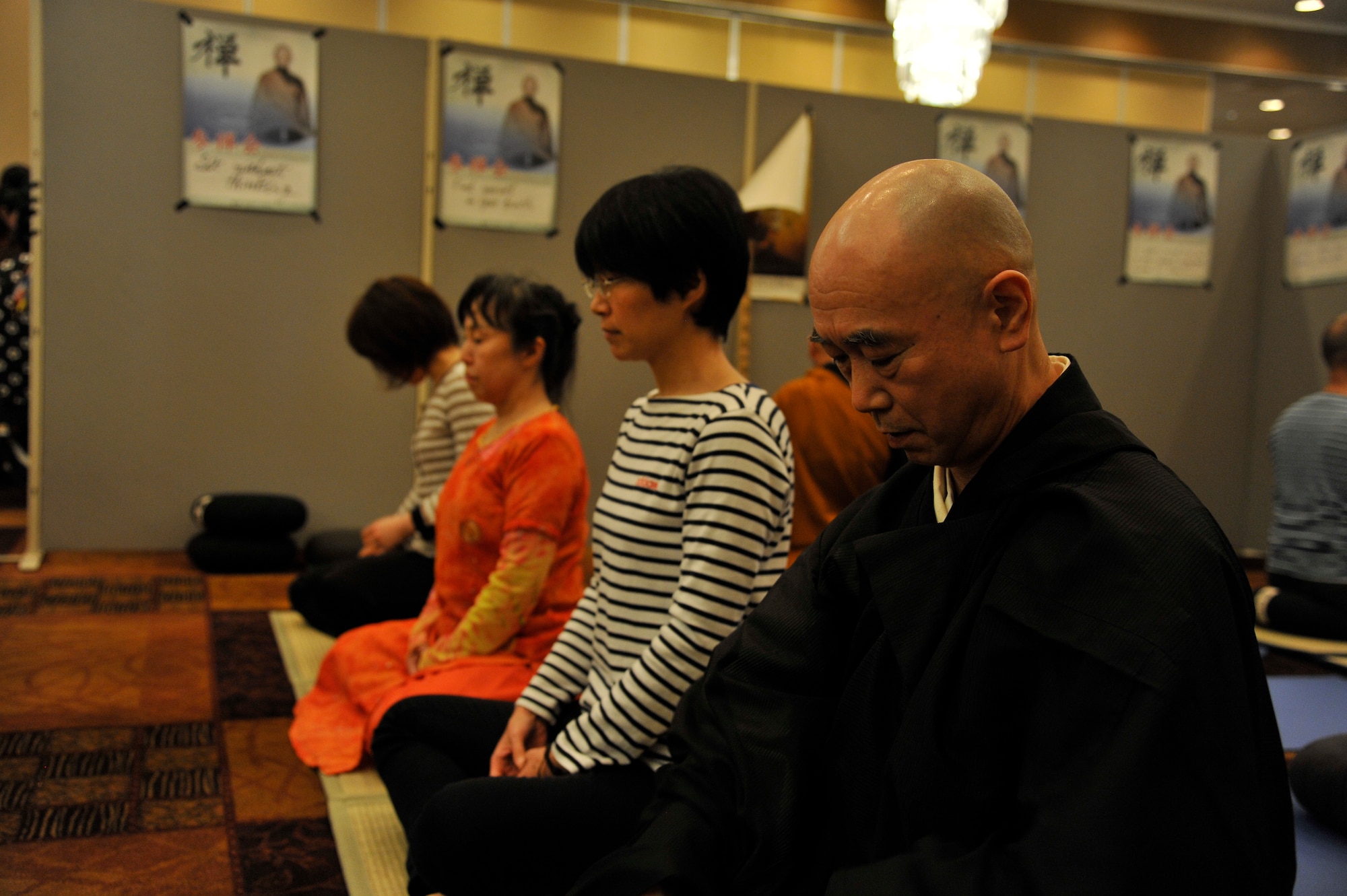 A Buddhist-practitioner sits in meditation during a Zen instruction class at Misawa Air Base, Japan, April 11, 2015. The class was one of Japan Day’s many events offered to Americans and their families. The class offered instructions on how to properly meditate, including breathing techniques and ways to pray. (U.S. Air Force photo by Senior Airman Patrick S. Ciccarone/Released)