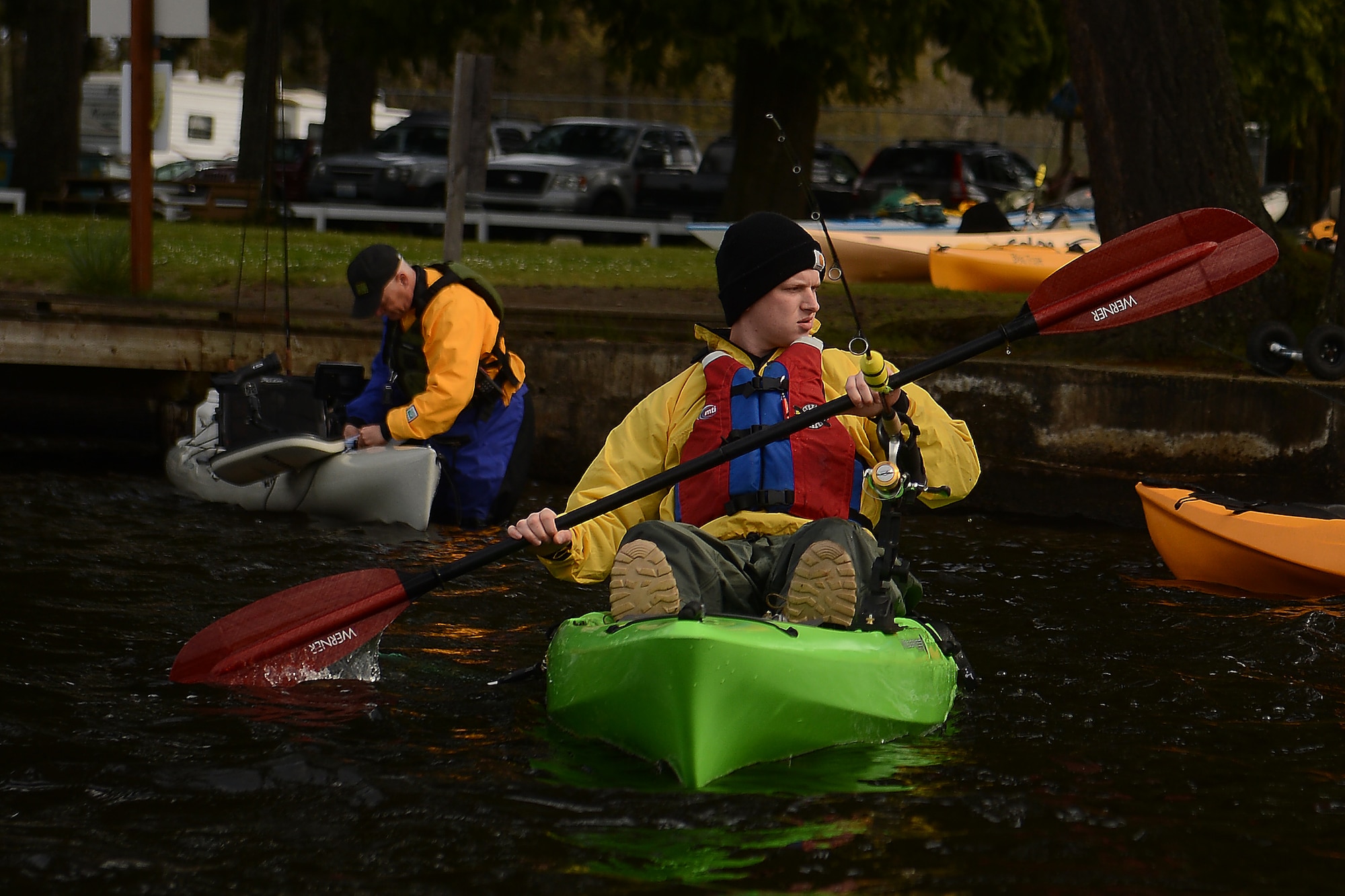 Spc. Zach Adams (right), 3-2 Stryker Brigade Combat Team, prepares for a day of fishing with Heroes on the Water April 11, 2015 at Tanwax Lake, Graham, Wash. Heroes on the Water is a non-profit organization that provides veterans and first responders with free opportunities for fishing. Participants receive basic kayak fishing and paddling instruction, angling clinics and paddling classes for participants with skill sets ranging from beginners to the most experienced paddlers. For more information on Heroes on the Water visit\ www.facebook.com/HeroesOnTheWaterNWest or email nwest@heroesonthewater.org. (U.S. Air Force photo by/Staff Sgt. Tim Chacon)