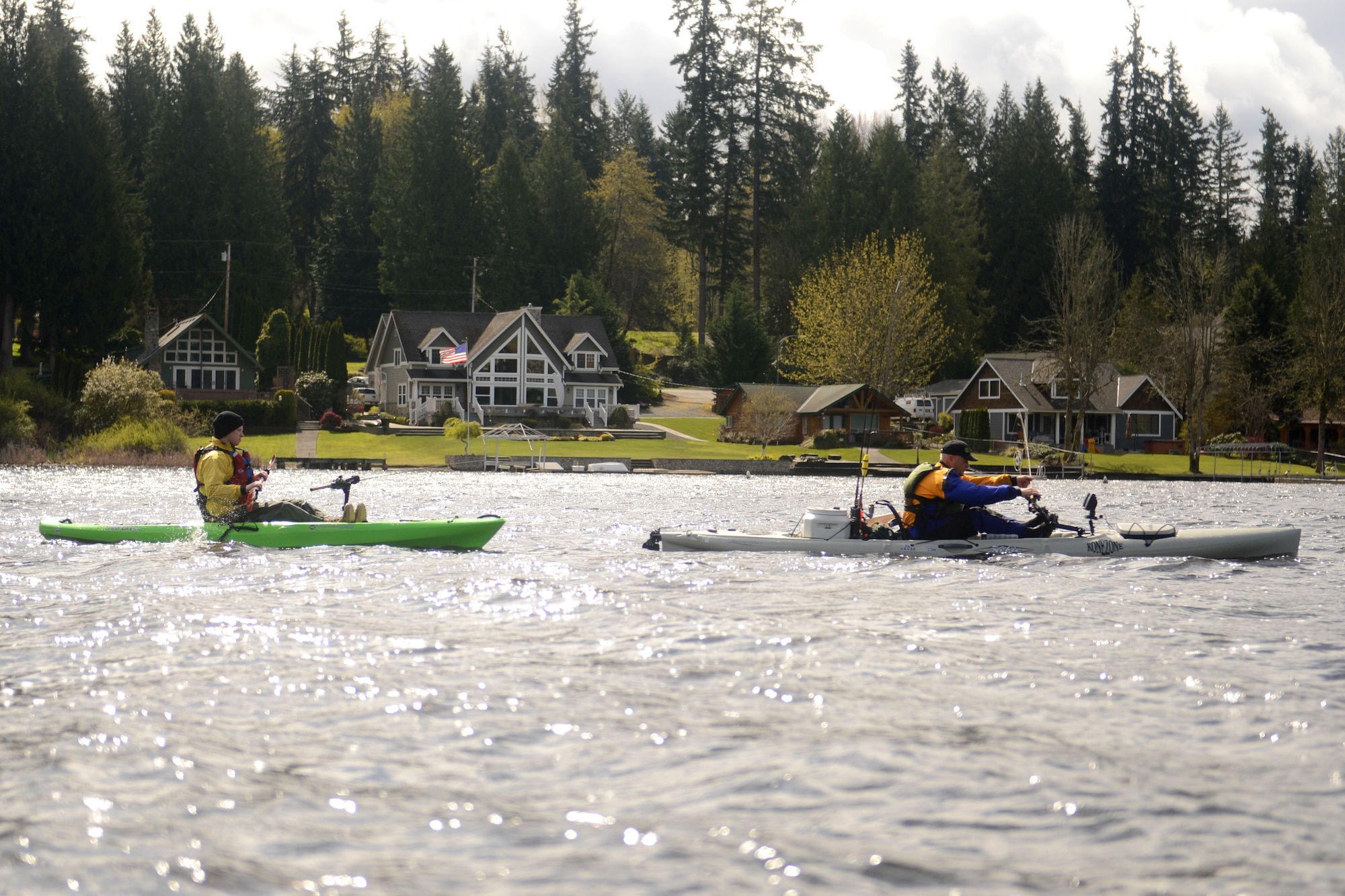 Chief Master Sgt. Gordon Drake (right), 62nd Airlift Wing Command Chief, guides Spc. Zach Adams, 3-2 Stryker Brigade Comabt Team, on a fishing trip with Heroes on the Water April 11, 2015 at Tanwax Lake, Graham, Wash. Heroes on the Water is a non-profit organization that provides veterans and first responders with free opportunities for fishing. Participants receive basic kayak fishing and paddling instruction, angling clinics and paddling classes for participants with skill sets ranging from beginners to the most experienced paddlers. For more information on Heroes on the Water visit\ www.facebook.com/HeroesOnTheWaterNWest or email nwest@heroesonthewater.org. (U.S. Air Force photo by/Staff Sgt. Tim Chacon)
