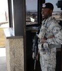 Airman 1st Class Danallen Lee, 341st Security Forces Squadron member, stands guard at a gate April 9, 2015, at Malmstrom Air Force Base, Mont. Lee was recently accepted to the Air Force Academy Preparatory School in Colorado Springs, Colo. (U.S. Air Force photo/ Airman 1st Class Dillon Johnston)