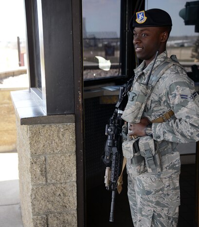 Airman 1st Class Danallen Lee, 341st Security Forces Squadron member, stands guard at a gate April 9, 2015, at Malmstrom Air Force Base, Mont. Lee was recently accepted to the Air Force Academy Preparatory School in Colorado Springs, Colo. (U.S. Air Force photo/ Airman 1st Class Dillon Johnston)