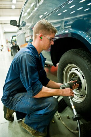 Airman 1st Class Levi Powers, 99th Logistics Readiness Squadron Vehicle Management Flight vehicle maintenance apprentice, removes a tire from a van to inspect the brakes at Nellis Air Force Base, Nev., April 7, 2015. Powers and fellow vehicle maintenance specialists ensure that government vehicles are kept to optimum performance. (U.S. Air Force photo by Airman 1st Class Jake E. Carter)