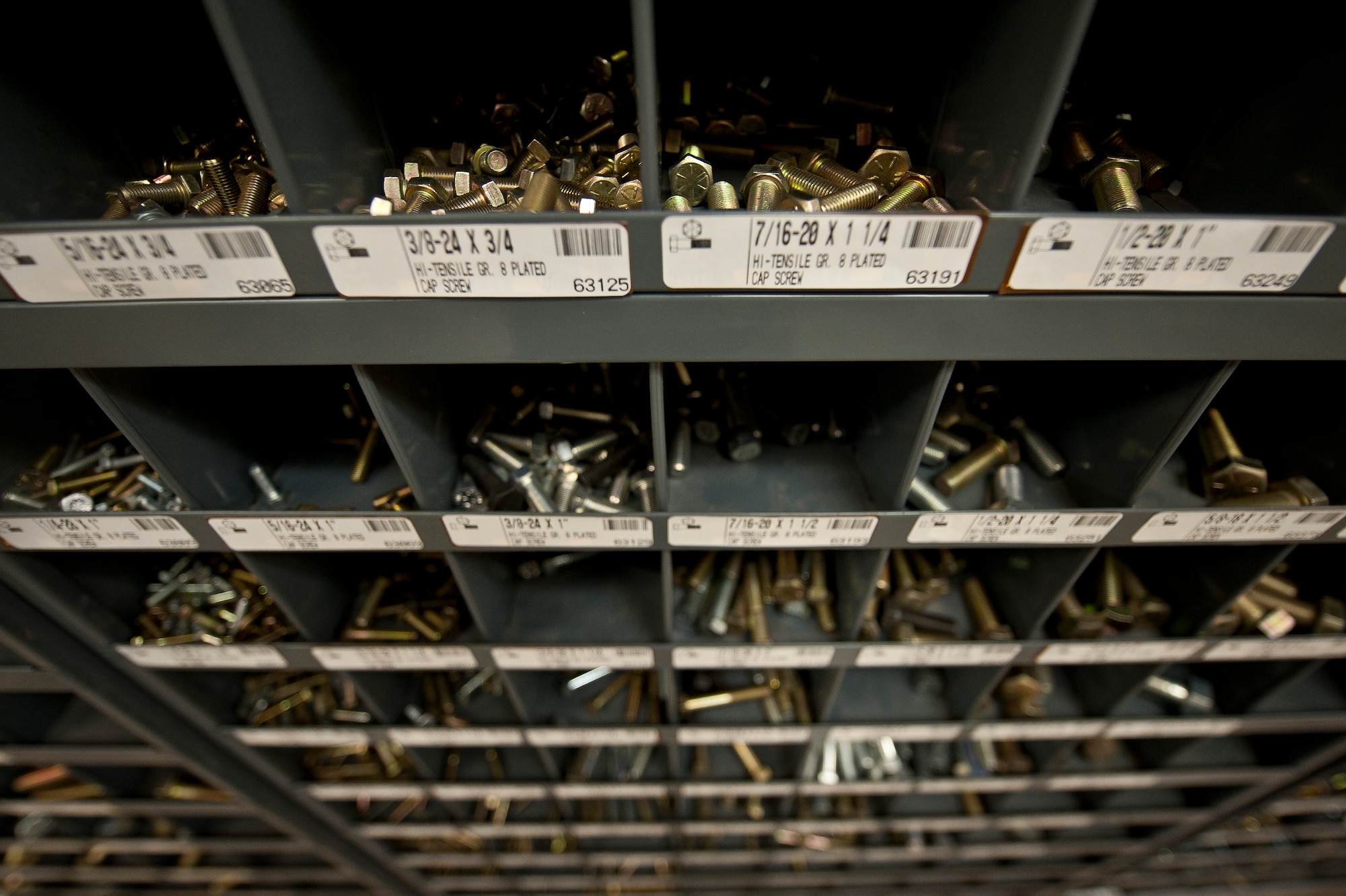 The 99th Logistics Readiness Squadron Vehicle Management Flight repair and maintain Air Combat Command’s largest vehicle fleet, utilizing various tools and hardware, such as screws, at Nellis Air Force Base, Nev., April 7, 2015. The flight is responsible for a vehicle fleet valued at $144.5 million. (U.S. Air Force photo by Staff. Sgt. Siuta B. Ika)
