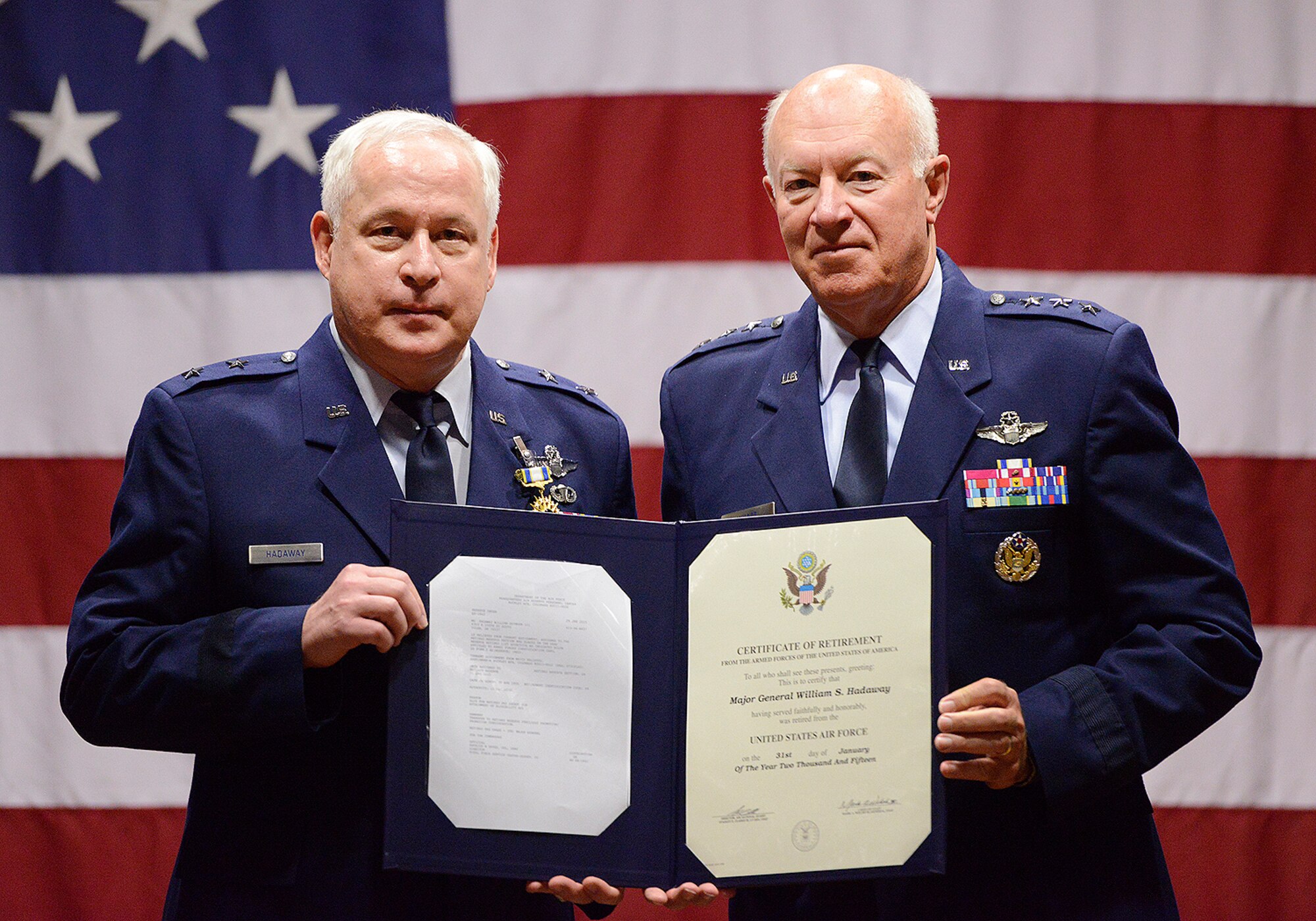 Maj. Gen William S. Hadaway III, former Director of Logistics, National Guard Bureau, receives his certificate of retirement from former Director of the Air National Guard Lt. Gen. Harry M. Wyatt III (ret.), April 11, at the Brig. Gen. Joseph W. Turner complex, Tulsa Air National Guard Base, Okla.  Both Wyatt and Hadaway were former wing commanders at the 138th Fighter Wing in Tulsa.  (U.S. National Guard photo by Master Sgt. Mark A. Moore/Released)