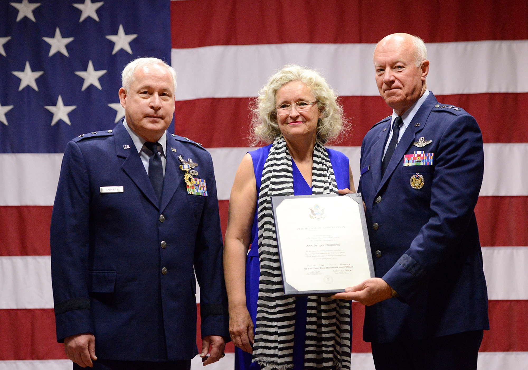Mrs. Ann Hadaway receives a certificate of appreciation from former Director of the Air National Guard Lt. Gen. Harry M. Wyatt III (ret.) for her years of support for her husband, Maj. Gen William S. Hadaway III, former Director of Logistics, National Guard Bureau, during his retirement ceremony, April 11, at the Brig. Gen. Joseph W. Turner complex, Tulsa Air National Guard Base, Okla.  Both Wyatt and Hadaway were former wing commanders at the 138th Fighter Wing in Tulsa.  (U.S. National Guard photo by Master Sgt. Mark A. Moore/Released)