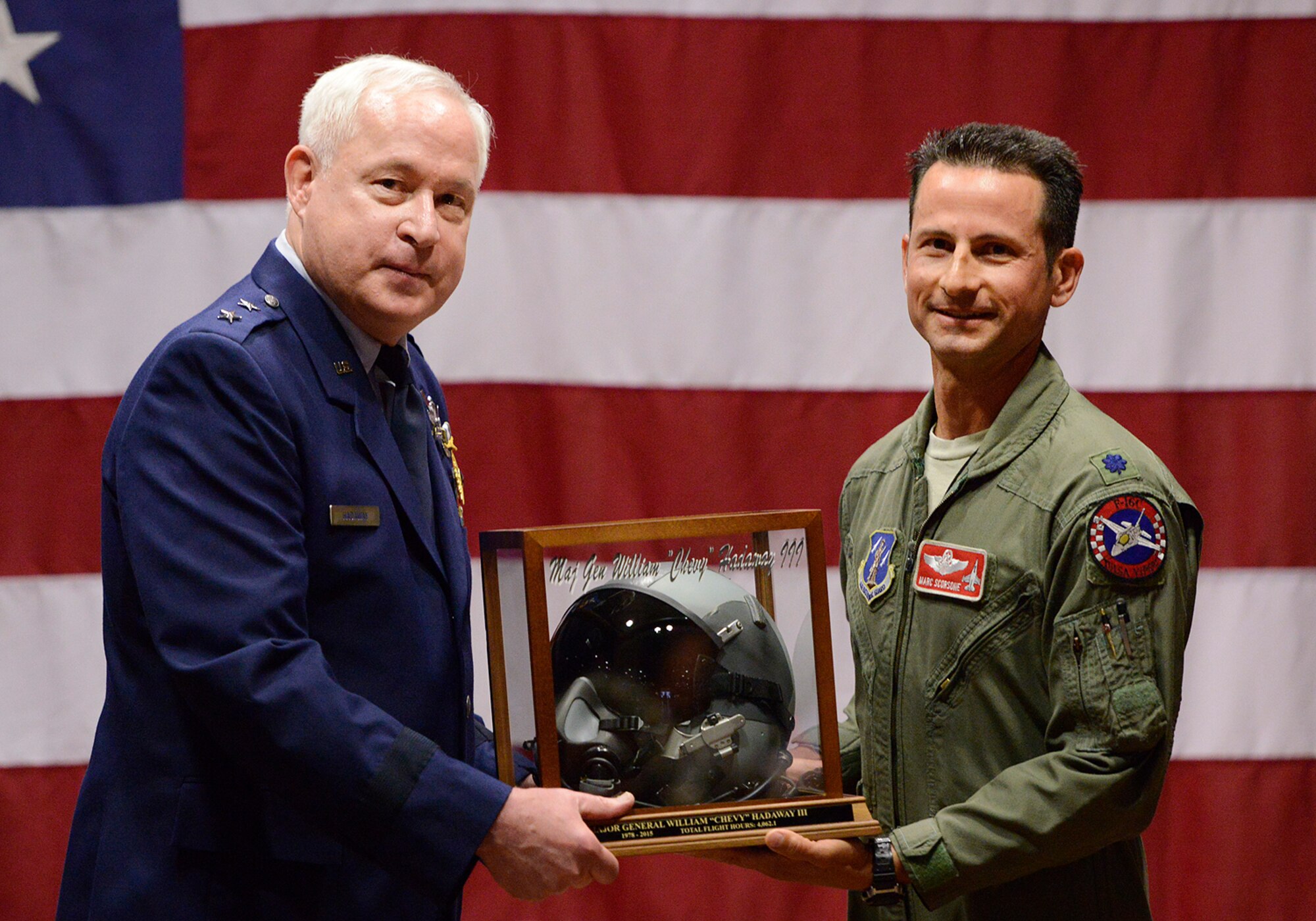 In appreciation for his contributions to the wing and more than 4000 flying hours, Maj. Gen William S. Hadaway III, former Director of Logistics, National Guard Bureau, receives an encased helmet from 125th Fighter Squadron Commander, Lt. Col. Marc Scorsone, April 11, at the Brig. Gen. Joseph W. Turner complex, Tulsa Air National Guard Base, Okla.   Hadaway was a former wing commander at the 138th Fighter Wing in Tulsa from Jan. 2004 to May 2008.  (U.S. National Guard photo by Master Sgt. Mark A. Moore/Released)