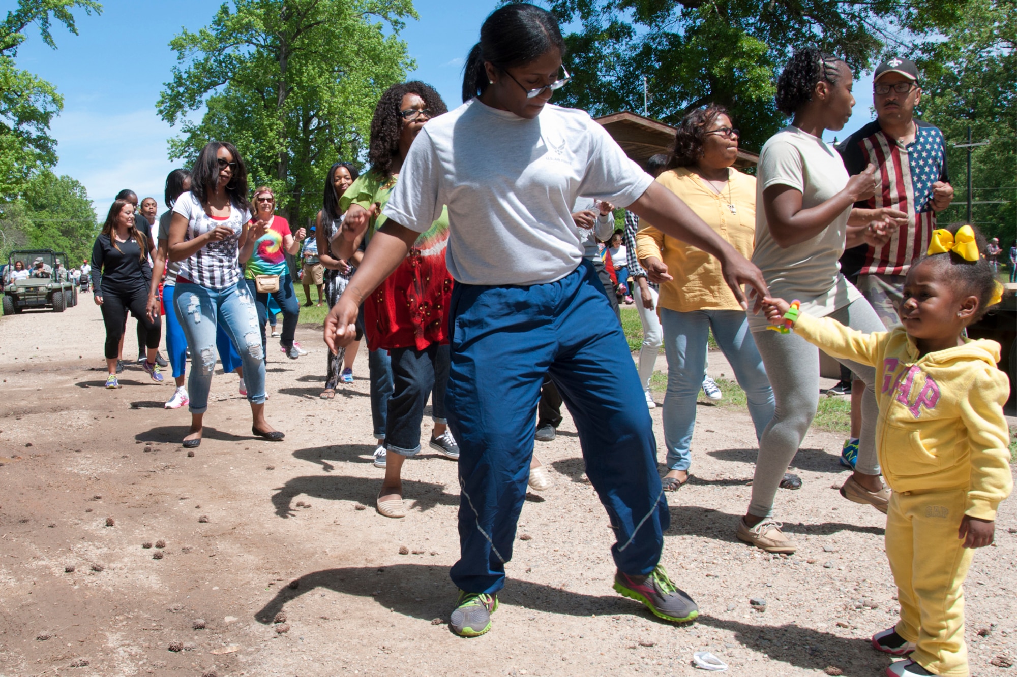 Music put everyone in the mood to line dance during 307th Bomb Wing Family Day at Barksdale Air Force Base, La., April 11, 2015.   Blue skies, mild temperatures, music, games and food drew large crowds to the annual event, which is designed to show appreciation for all the sacrifices made my Airmen and their families during the year.   In addition to all the other events, the day featured a gumbo cook-off judged by Vietnam Veterans, and a car show that allowed members of the wing to show off their mechanical skills and passion for their automobiles. (U.S. Air Force photo by Tech. Sgt. Ted Daigle/Released)