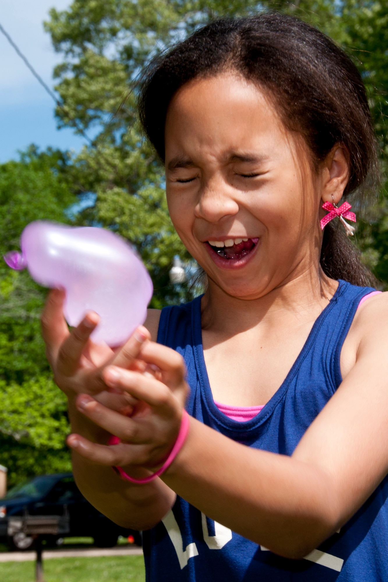 Naveya Mitchell cringes as she tries to catch a water balloon during 307th Bomb Wing Family Day activities at Barksdale Air Force Base, La., April 11, 2015.  She participated in the balloon toss, one of many games offered during the day to Airmen of the 307th BW and their families.  In addition to the games, participants enjoyed music, food, train rides and a fun jump.  Blue skies and mild weather only added to the event, which is held annually to show appreciation for the sacrifices made by Airmen of the wing and their family members throughout the year. (U.S. Air Force photo by Tech. Sgt. Ted Daigle/Released)