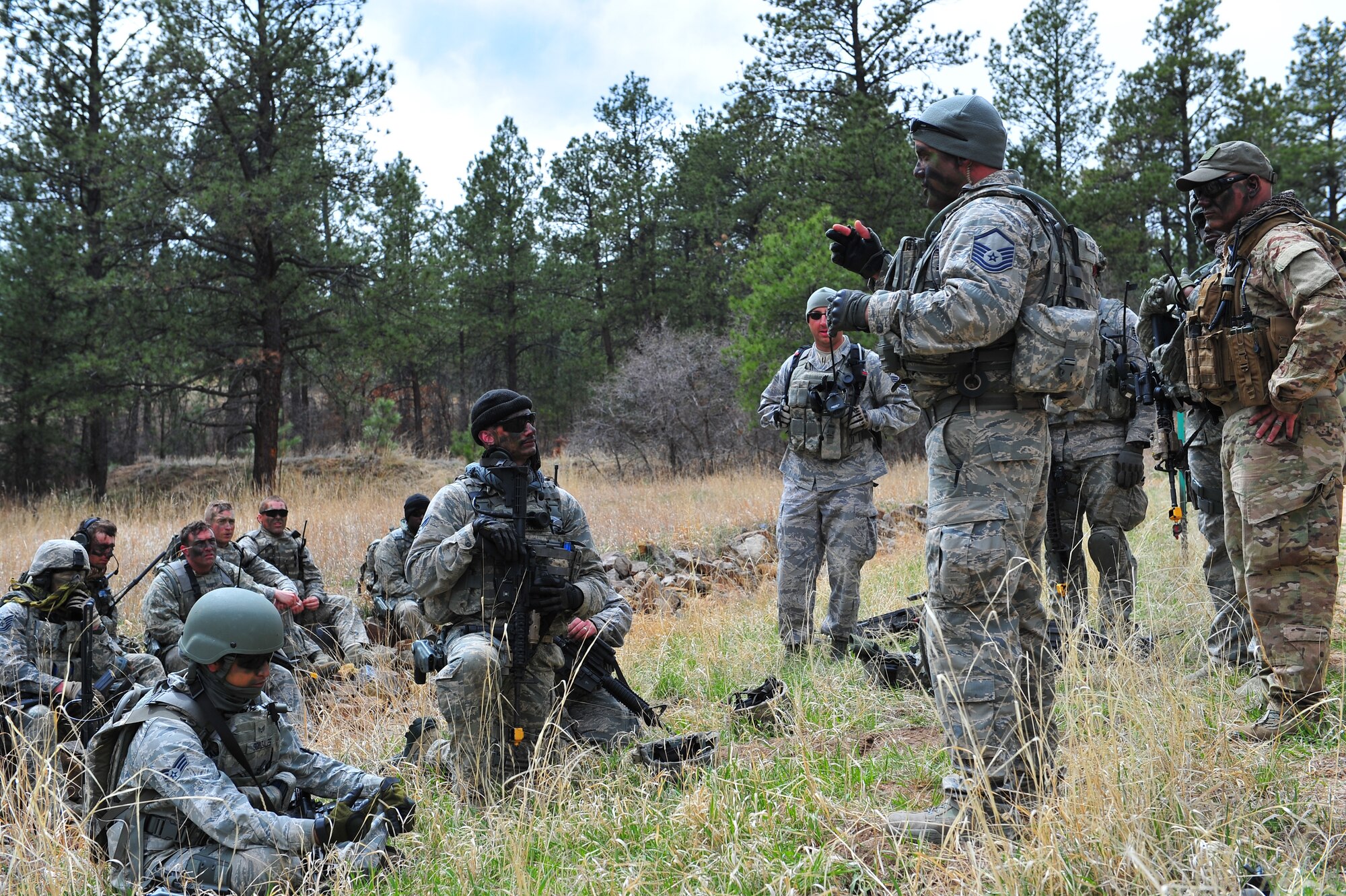 Air Force Reservists from the 710th and 310th Security Forces Squadrons based out of Colo., receive their debriefing from Master Sgt. Casey Karins after completing the last mission of training April 9, 2015, at the U.S. Air Force Academy in Colorado Springs, Colo. The 710th and 310th Security Forces Squadrons held a joint combat leaders course while living in field conditions. The 710th SFS is out of Buckley Air Force Base, Colo., and the 310th is out of Schriever AFB.
(U.S. Air Force photo/Tech. Sgt. Nicholas B. Ontiveros)