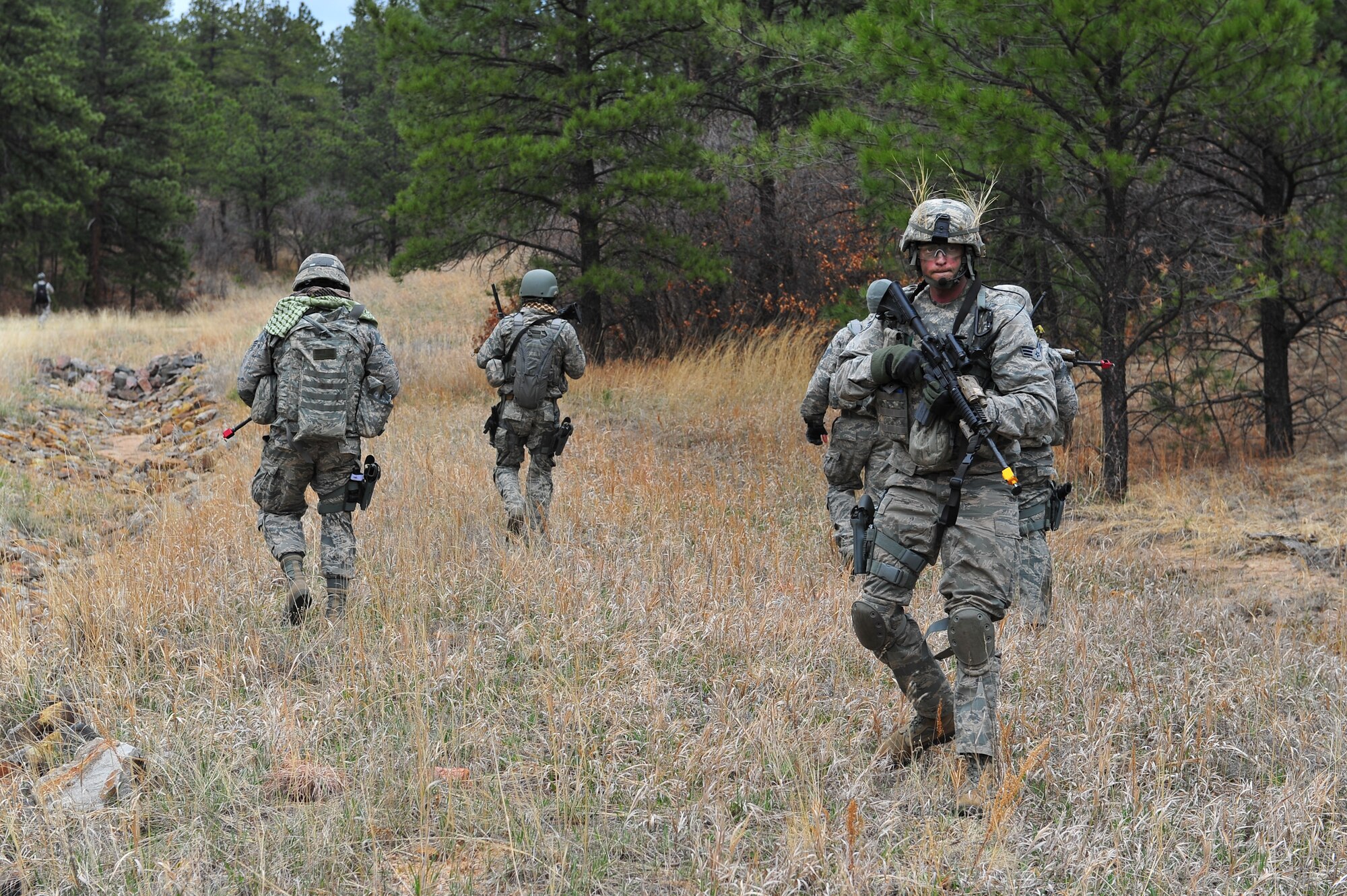 Air Force Reservist Senior Airman Robert Vens provides rear security during a training  mission April 9, 2015, at the U.S. Air Force Academy in Colorado Springs, Colo. The 710th and 310th Security Forces Squadrons held a joint combat leaders course while living in field conditions. The 710th SFS is out of Buckley Air Force Base, Colo., and the 310th is out of Schriever AFB.
(U.S. Air Force photo/Tech. Sgt. Nicholas B. Ontiveros)